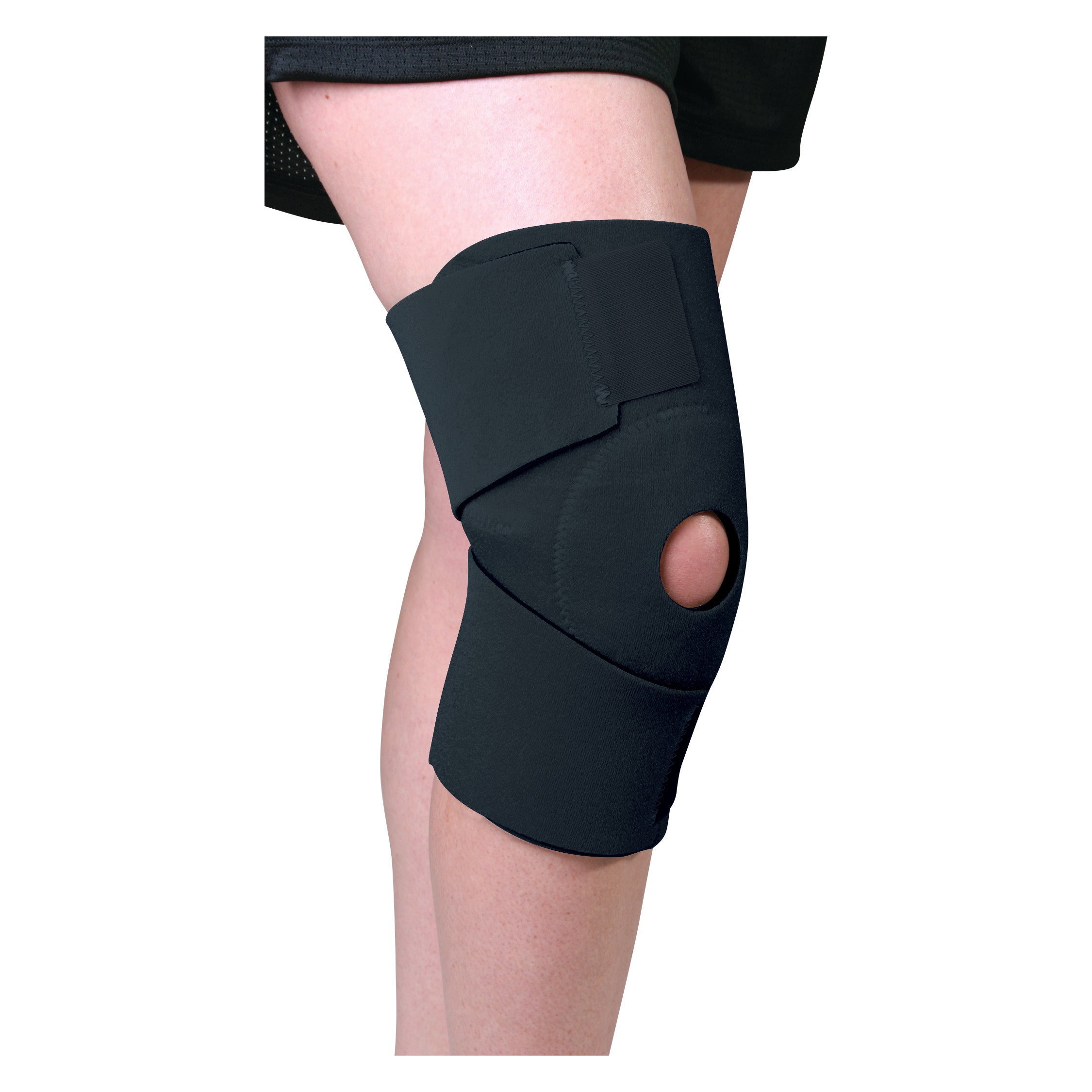 A person's leg is shown wearing an AliMed Neoprene Knee Support with an open patella design in black.