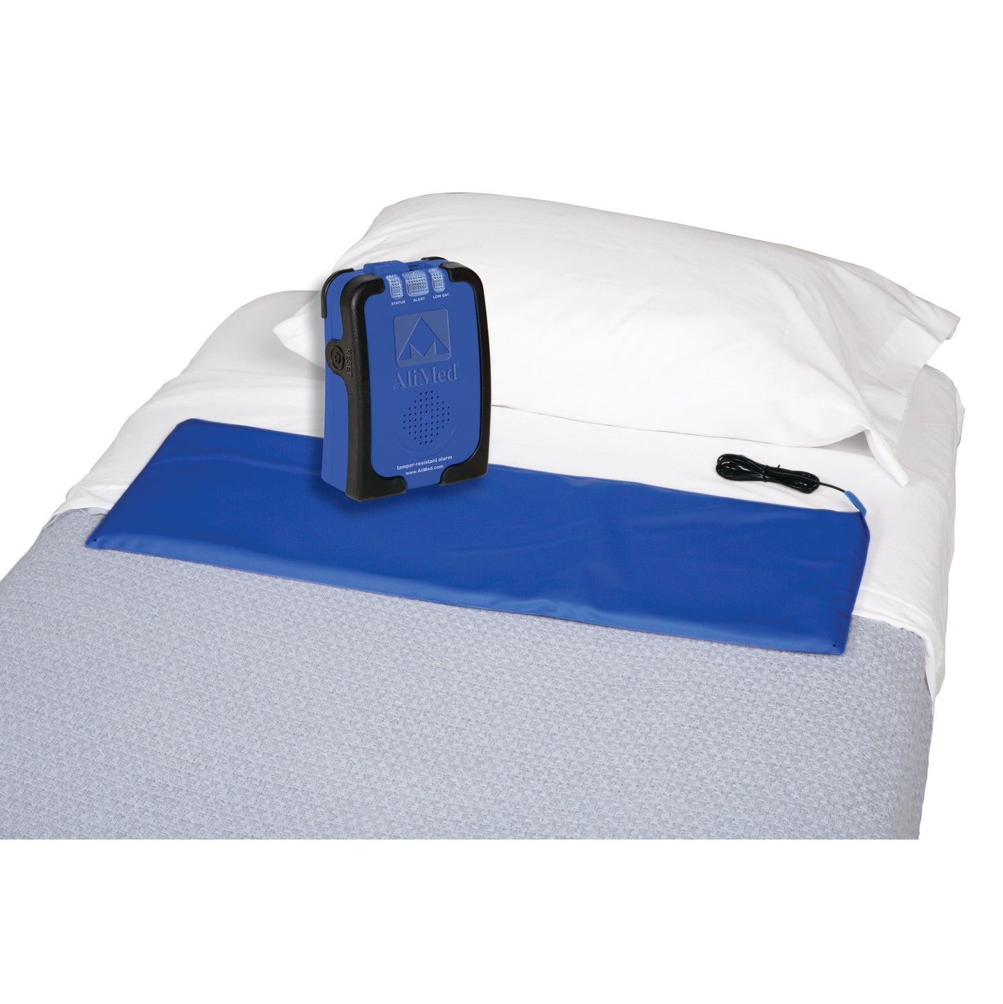 AliMed IQ Sensor Alarm with Bed Sensor Pad on a bed. The alarm is a blue device, and the pad is placed under a white pillow.