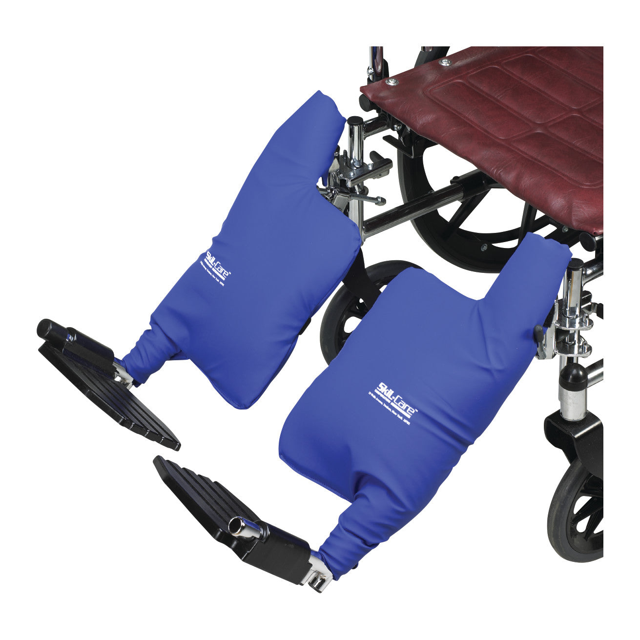 Blue SkiL-Care Calf Pad Covers are attached to a wheelchair's footrests, providing cushioning and protection for the calves.