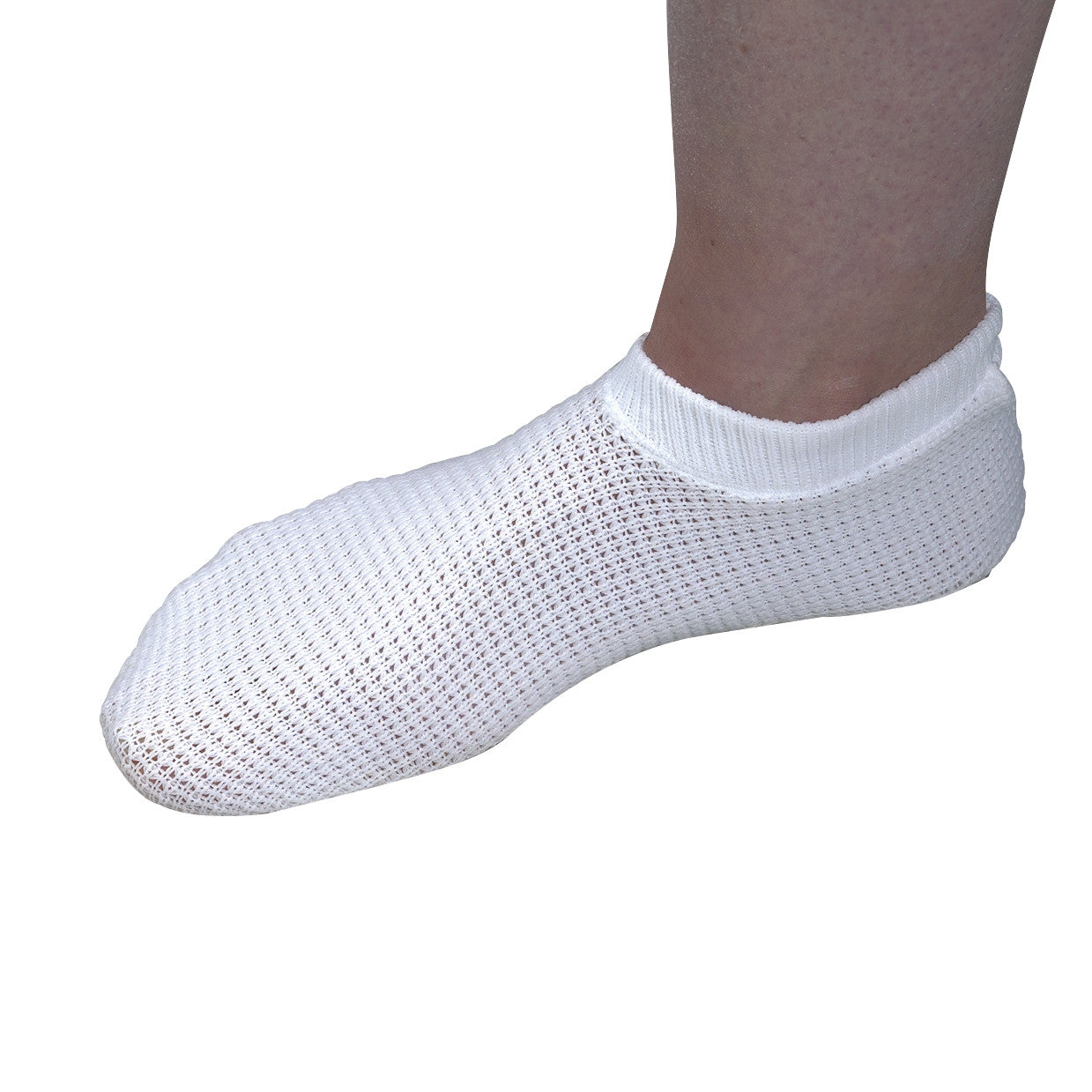 A foot wearing a Posey Quick-Dry Slipper, featuring a white mesh design for ventilation and a fitted elastic cuff.