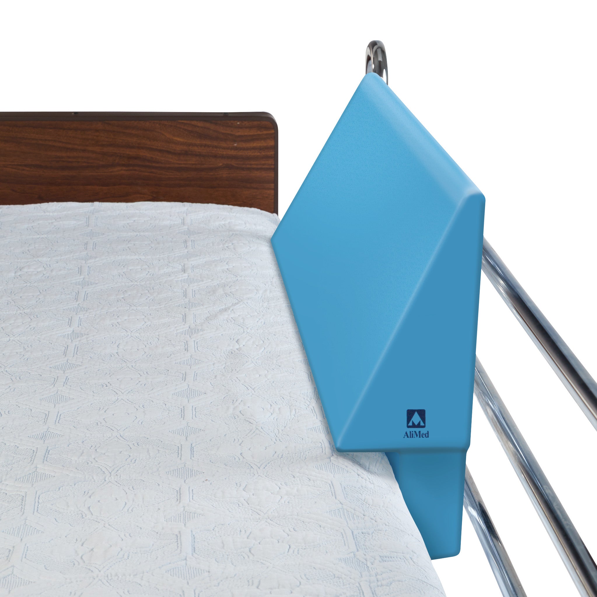 Blue AliMed Antimicrobial Waterproof Foam Bed Bolster on a bed, positioned against a metal rail with a white quilted cover.