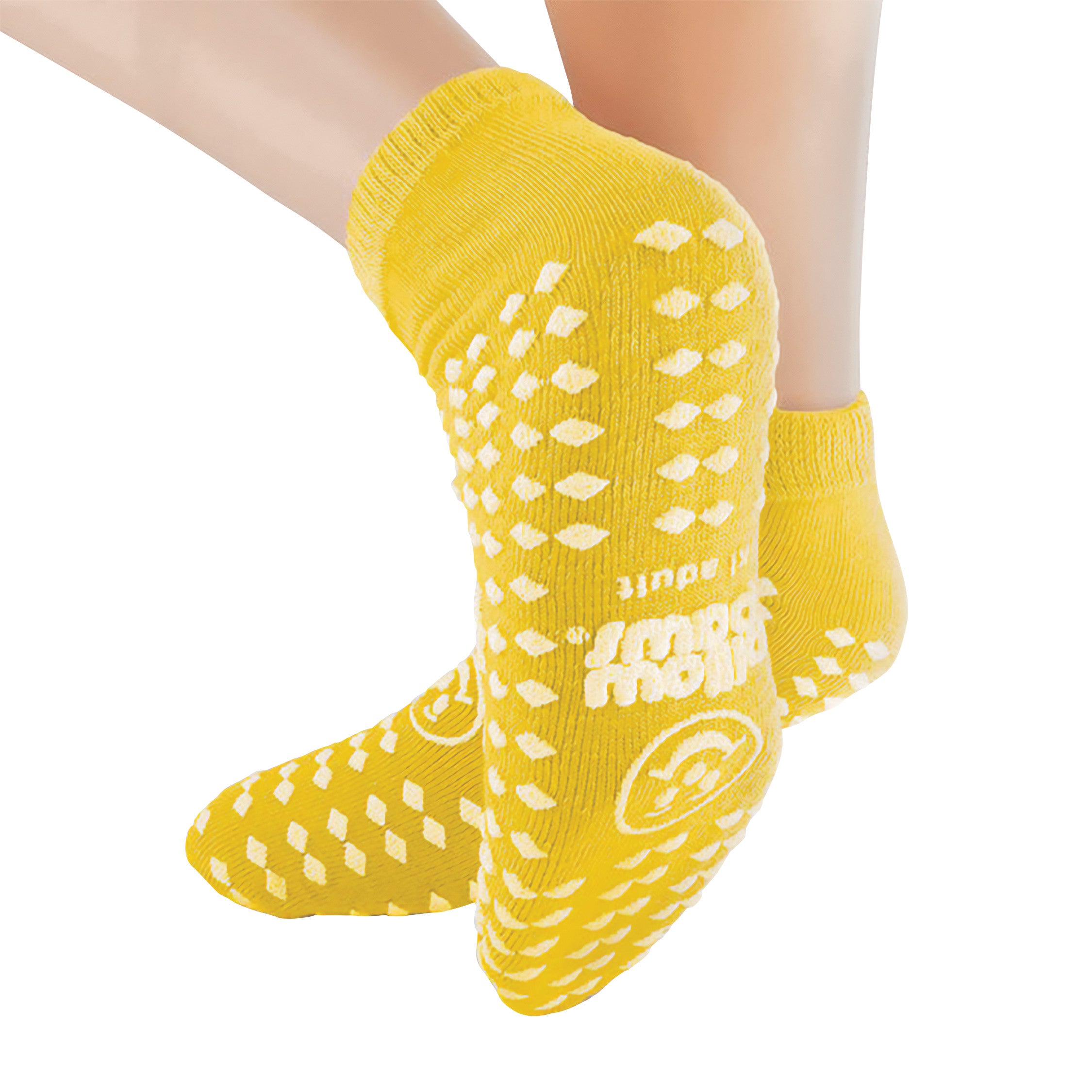 Person wearing yellow Pillow Paws Double Print Risk-Alert Socks with white non-slip patterns on soles.