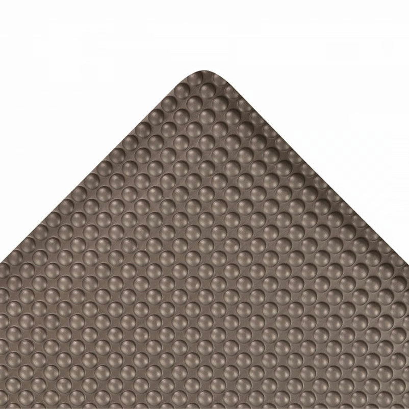 Close-up of a Bubble Trax Anti-Fatigue Mat corner, featuring a textured surface with evenly spaced raised bubbles.