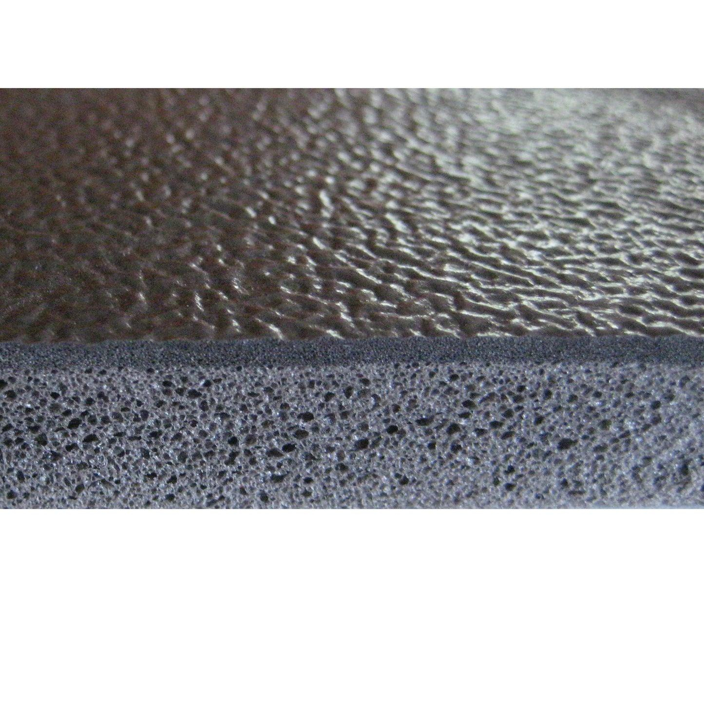 Close-up of the FabSafe Anti-Slip Fall Mat edge, showing a textured brown surface and porous material underneath.