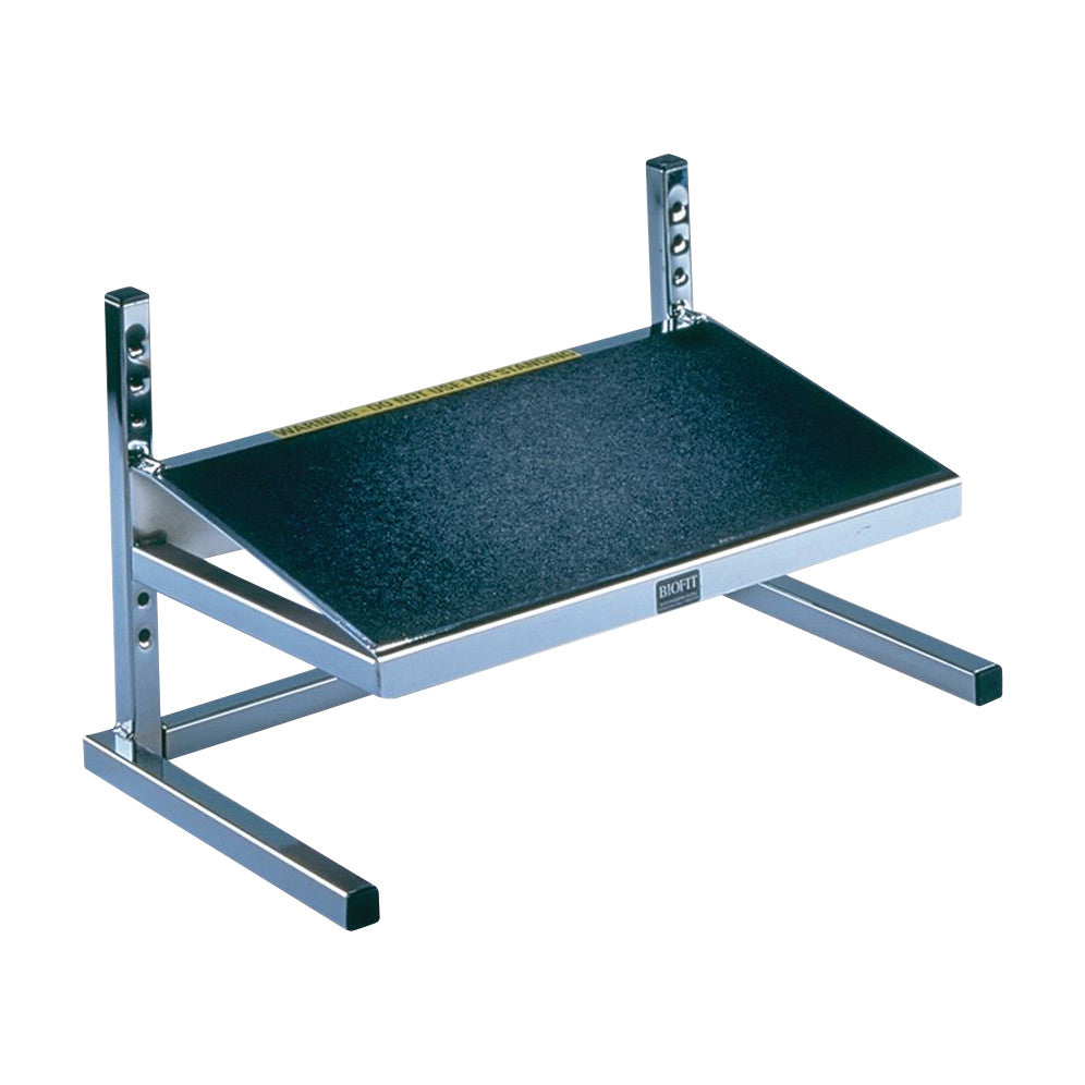 BioFit Factory Footrest with adjustable height, black textured platform, and a silver metal frame for ergonomic support.