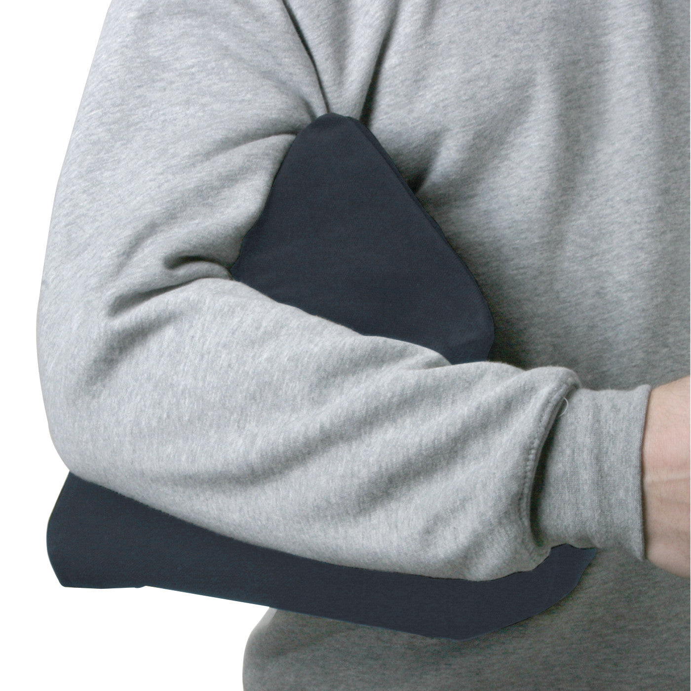 A person wearing a gray sweatshirt holds an AliMed 65-Degree Elbow Positioning Wedge under their arm.