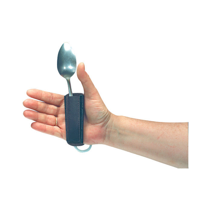 A hand wearing a Therafin Quad Care Utensil Holder Cuff, holding a spoon. The cuff secures the utensil for easier handling.