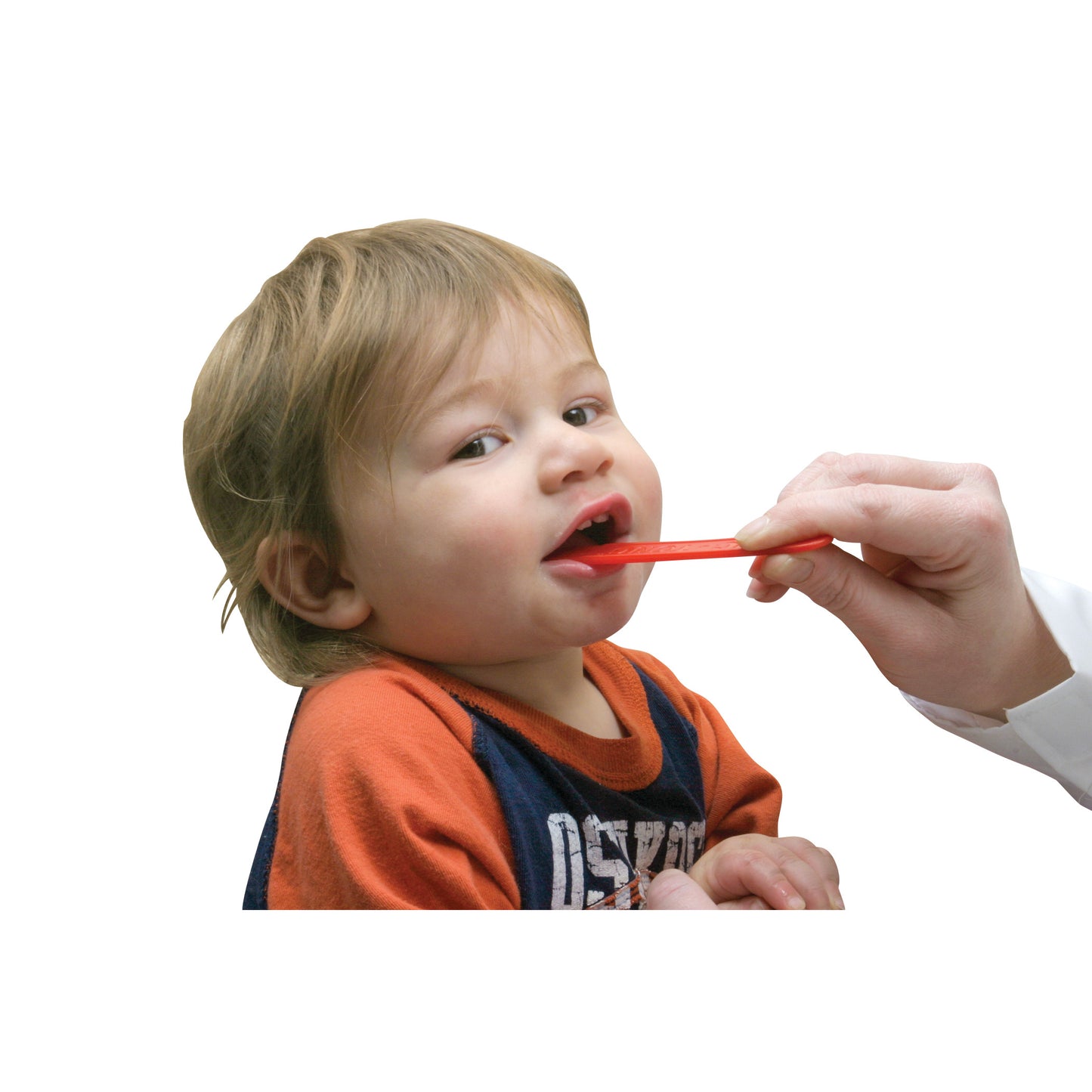 A young child uses a Tic-Tong Flavored Tongue Depressor. An adult hand holds the red depressor near the child's mouth.