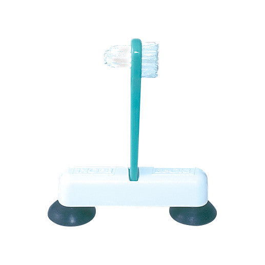 Therafin One-Handed Denture Brush with a turquoise handle on a white base. It features two suction cups for stability.