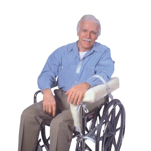 An older man in a wheelchair uses the SkiL-Care Lateral Arm/Body Support, which is strapped to the wheelchair armrest.