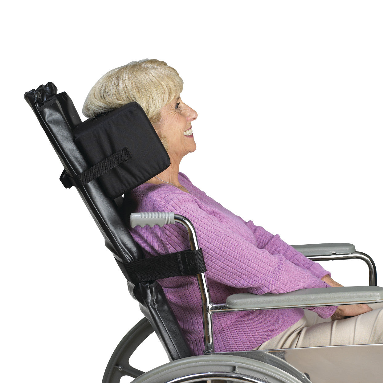 Elderly person using the SkiL-Care Reclining Wheelchair Headrest in a wheelchair, providing neck and head support.