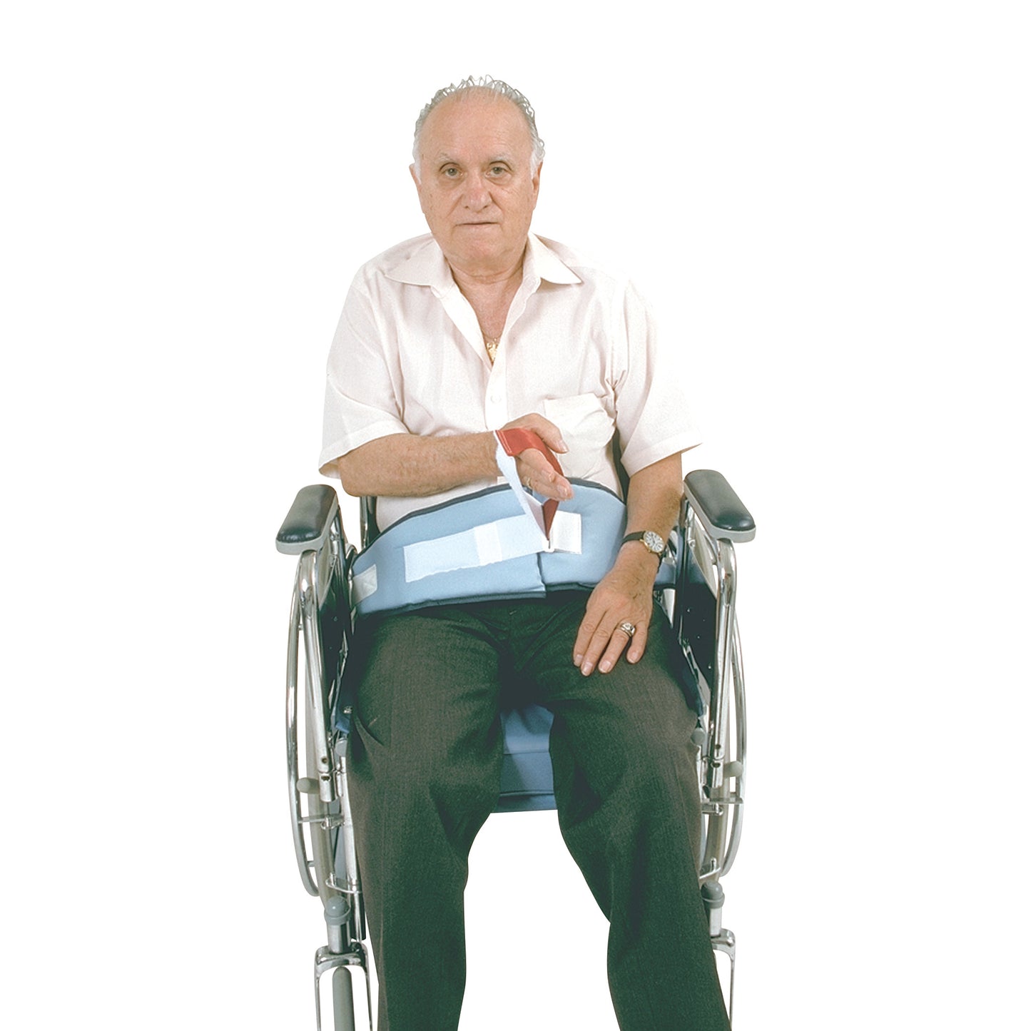 An elderly man sits in a wheelchair using a SkiL-Care Easy-Release Soft Wheelchair Belt, securing him comfortably.