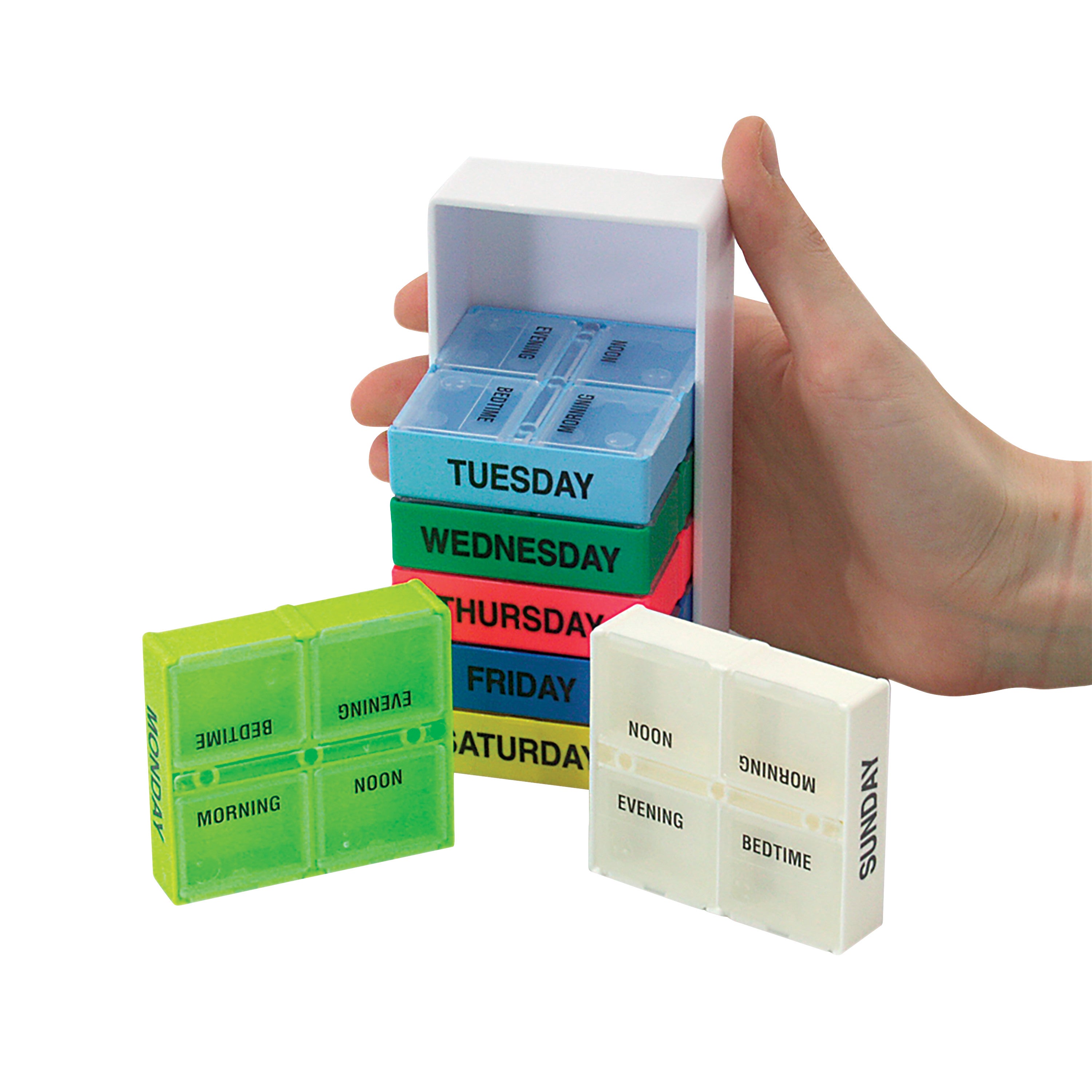 A hand holds a 7-Day Pill Box with stacked, colorful daily compartments labeled Sunday to Saturday. Each box has four time slots.