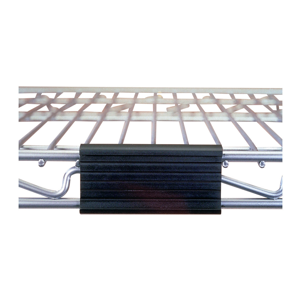 A Nexel Label Holder attached to a metal wire shelf, displaying a black, rectangular label holder with grooved texture.