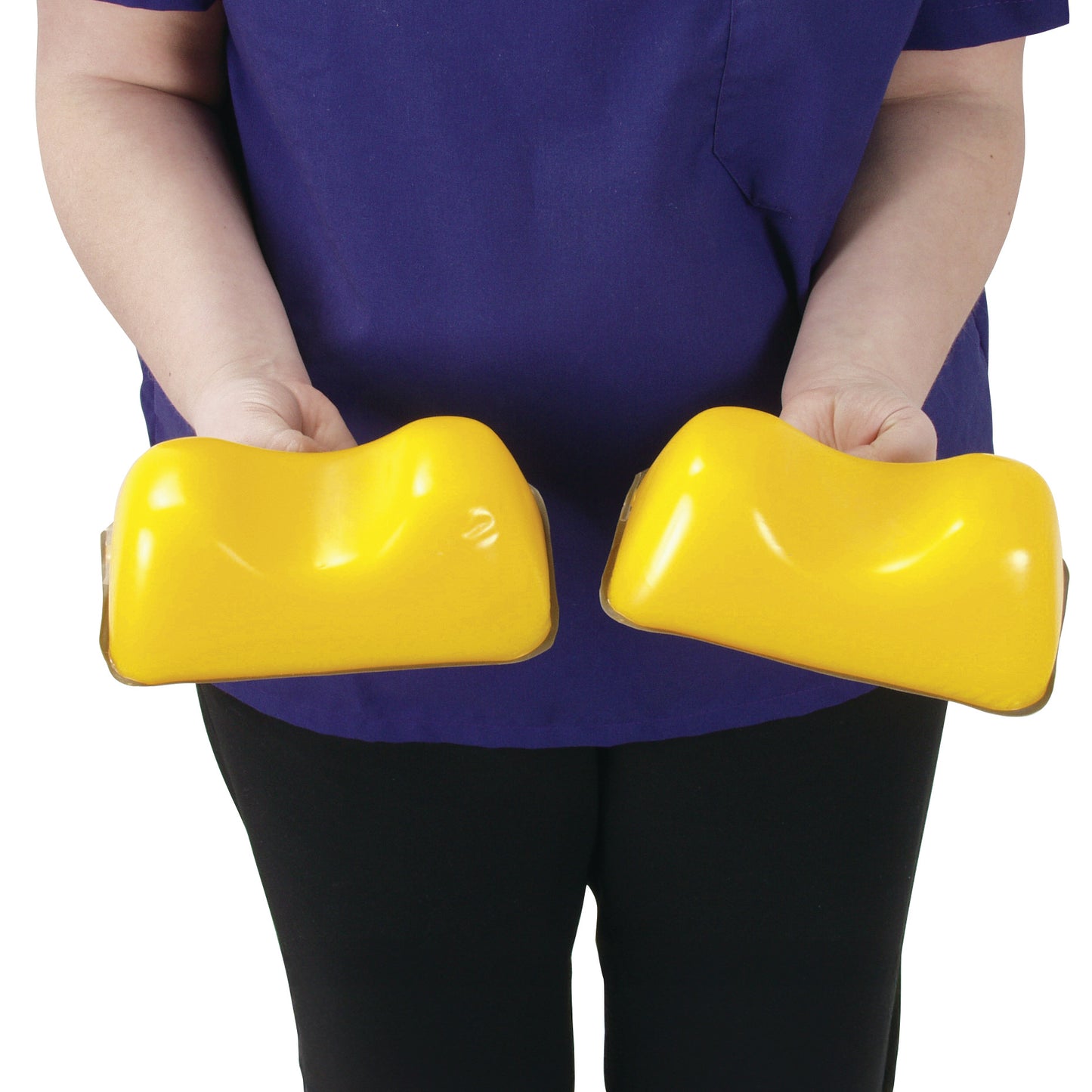 A person holds two yellow AliMed AliLite Heel Pads, designed to provide cushioning and pressure relief for heels.
