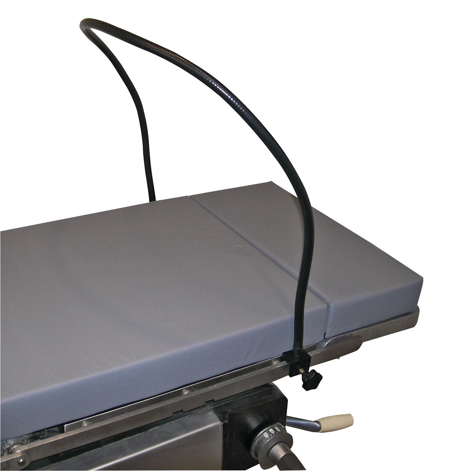 A Malleable Anesthesia Screen with Built-in Rail Clamps is attached to an operating table. It features a flexible, curved design.