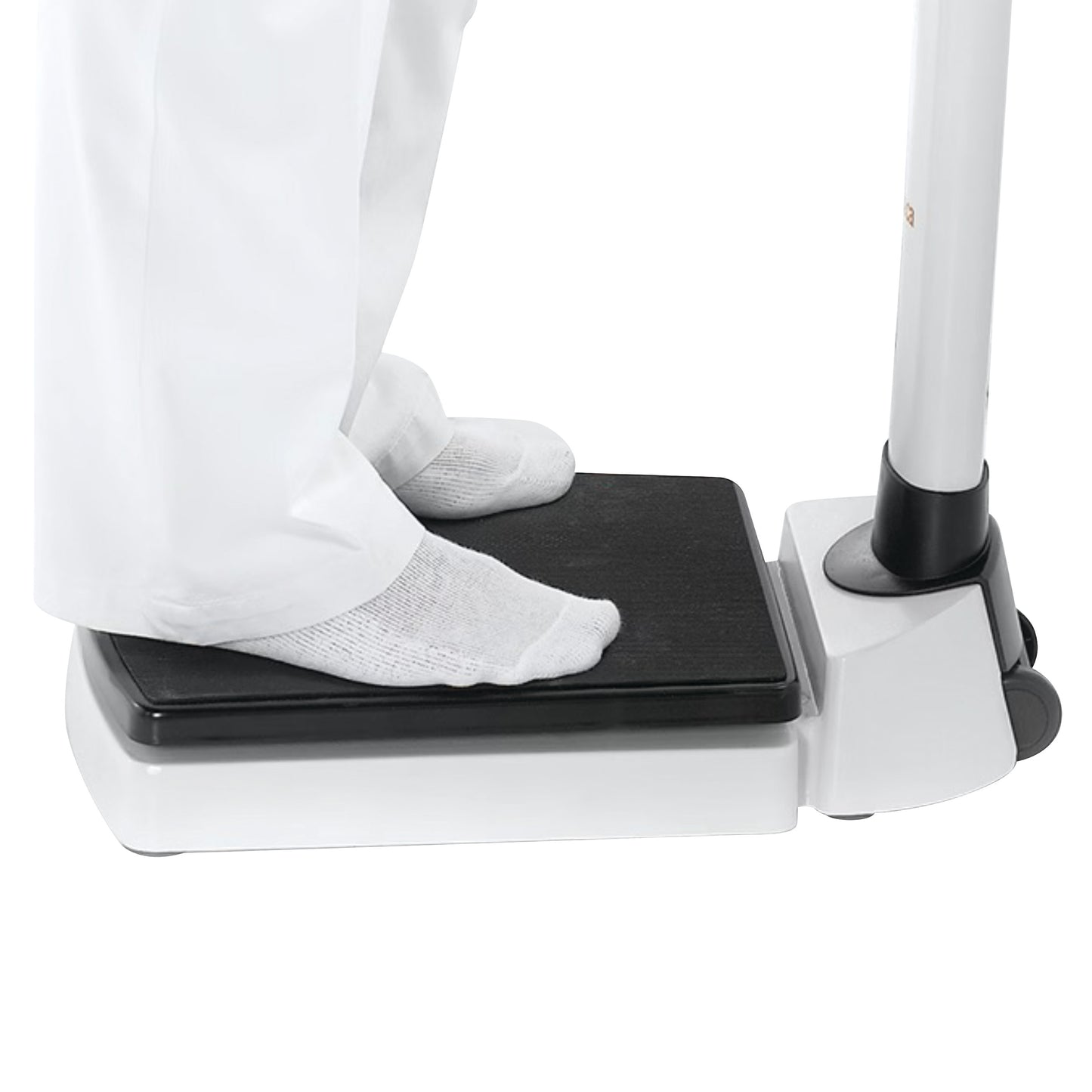 Person standing on a seca 703 Column Scale, wearing white pants and socks.
