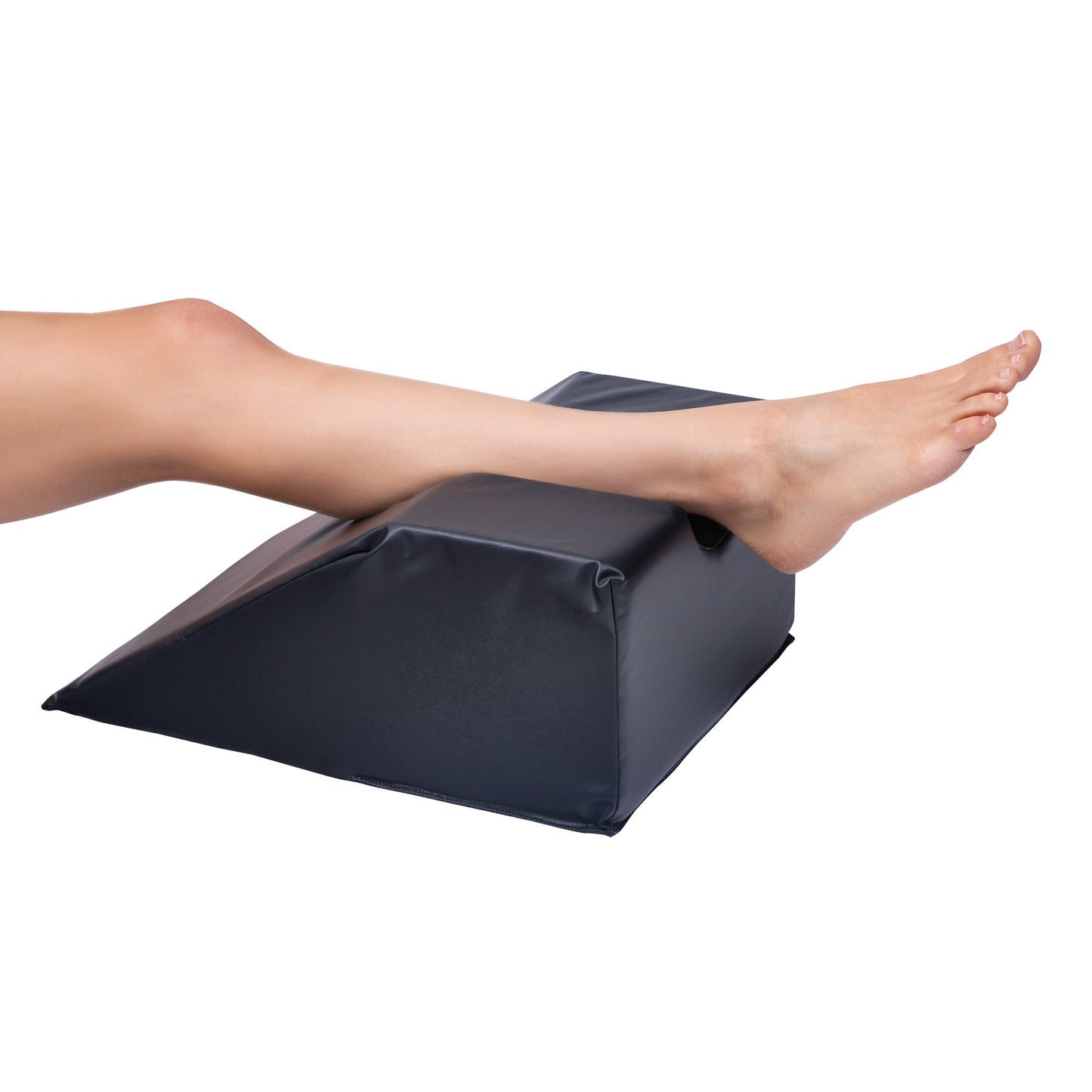 A leg rests on an AliMed Foot/Hand Prepper, a black wedge-shaped cushion, for comfort and support.