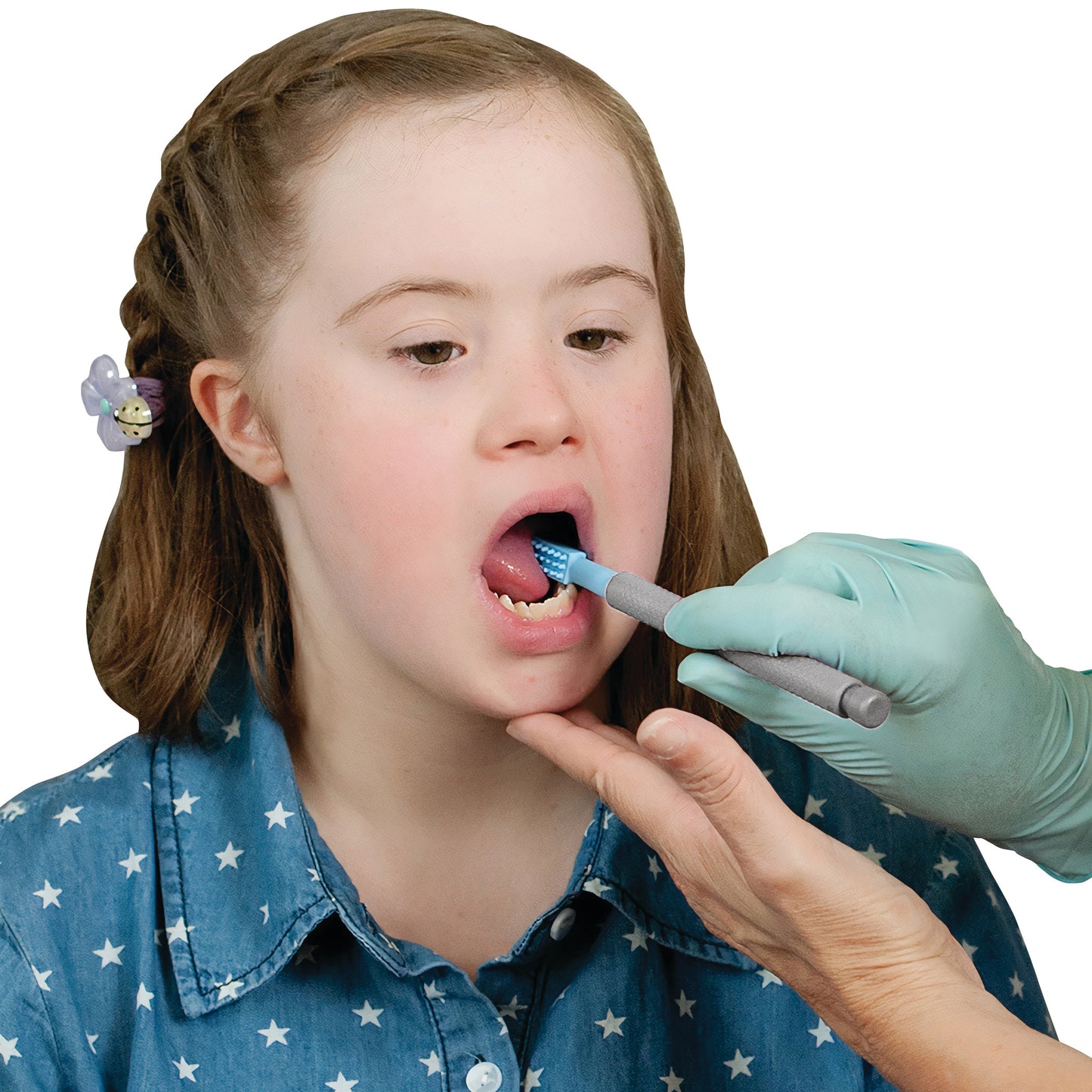 A child using the ARK Z-Vibe Vibrating Oral Motor Tool held by a gloved hand in their open mouth.