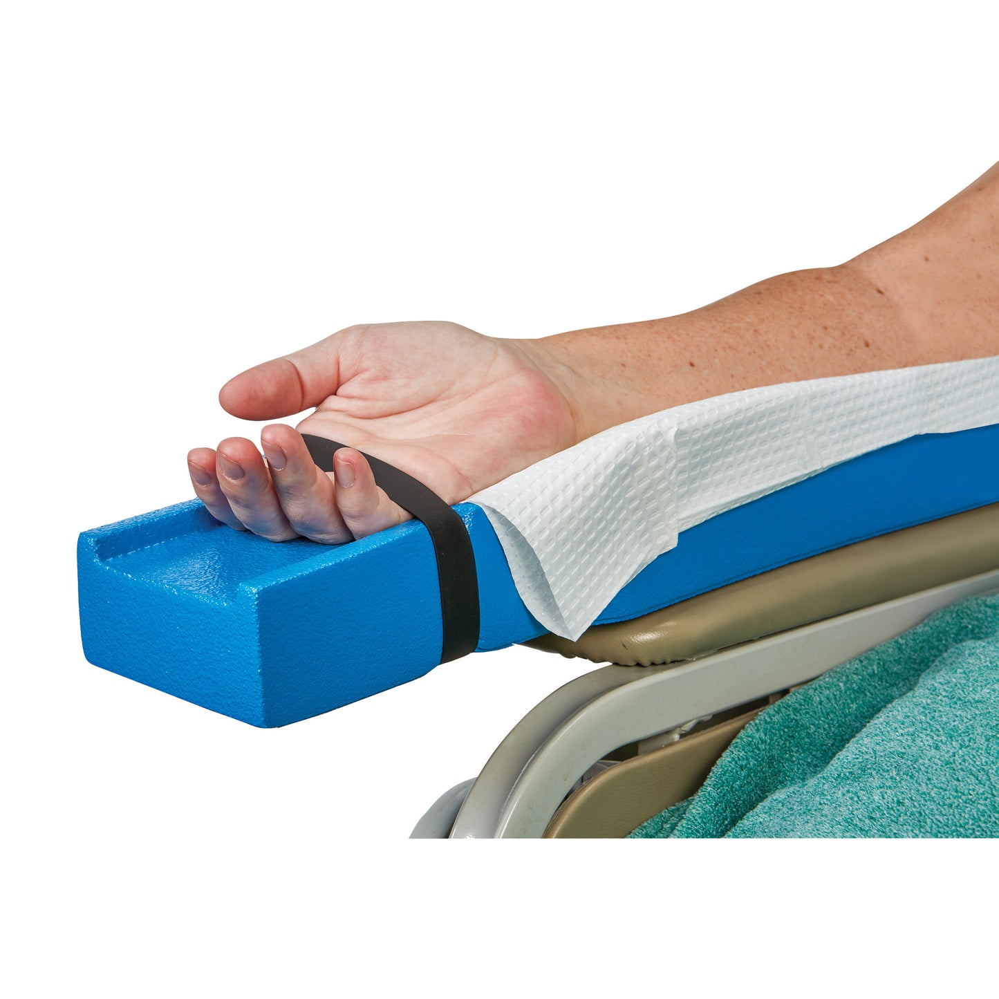 The AliMed Dialysis Arm Positioner Kit. A hand is secured with a strap on a blue foam arm support on a chair.