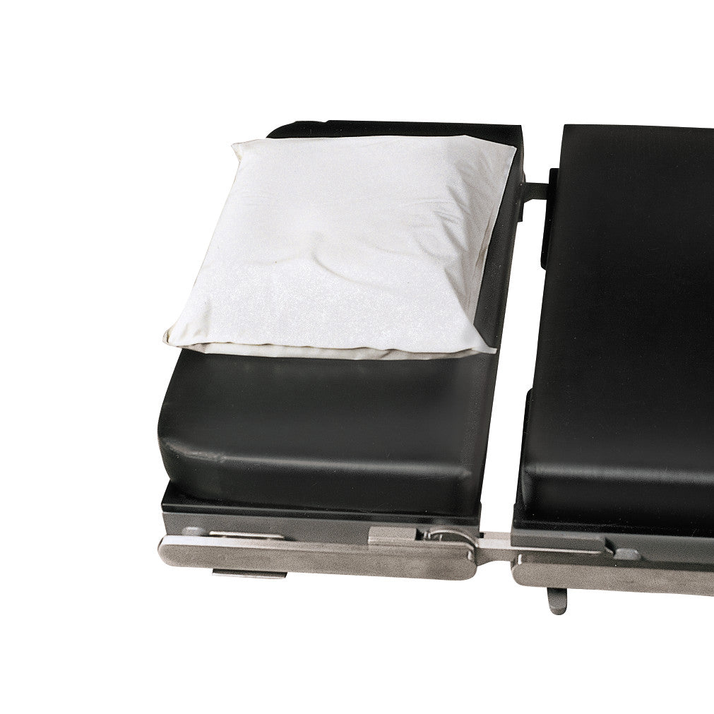 An Action Gel Supine Head Pad placed on a black surgical table with metal frame edges.