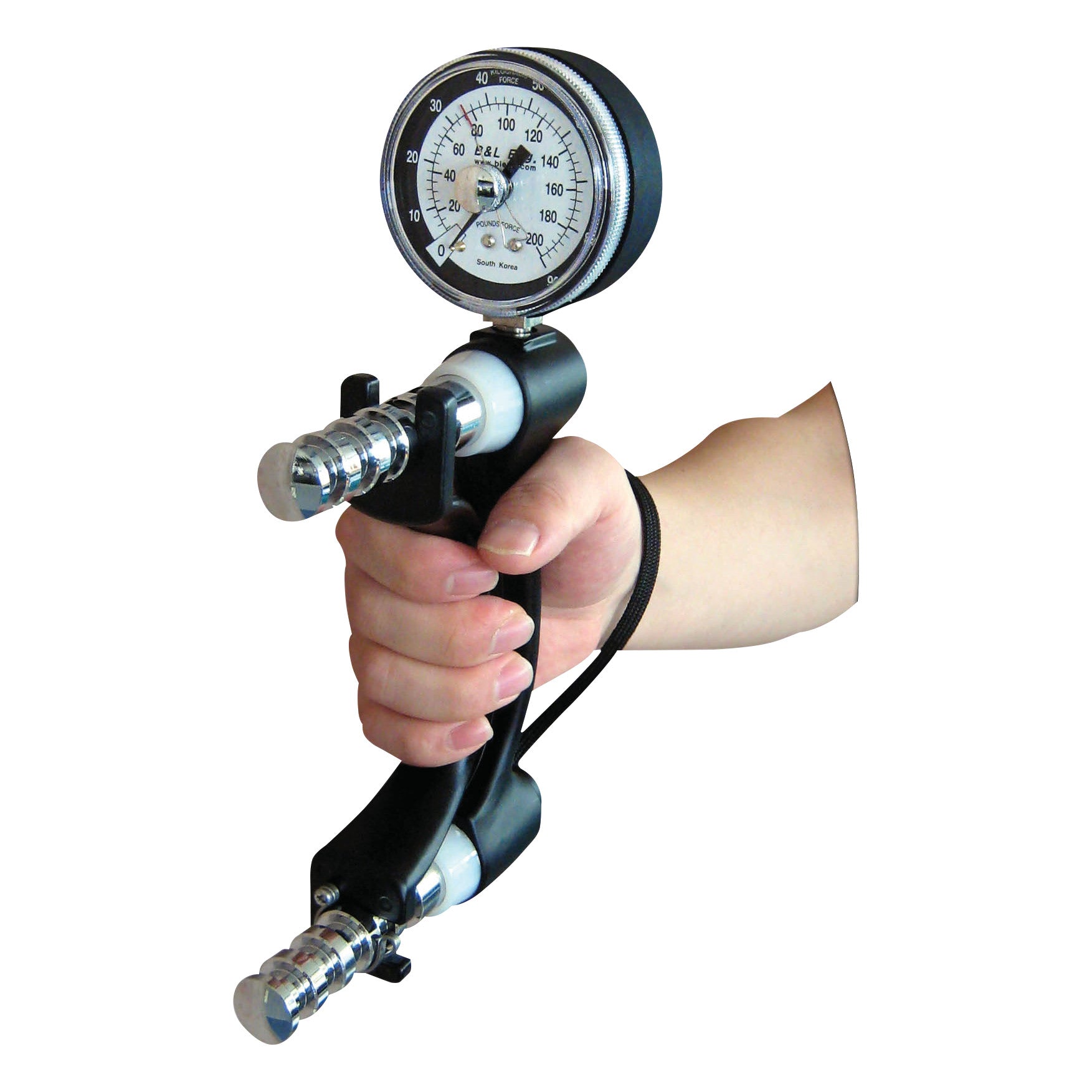 A hand holds a B&L Engineering Hand Dynamometer, a device for measuring grip strength, featuring a prominent round gauge display.