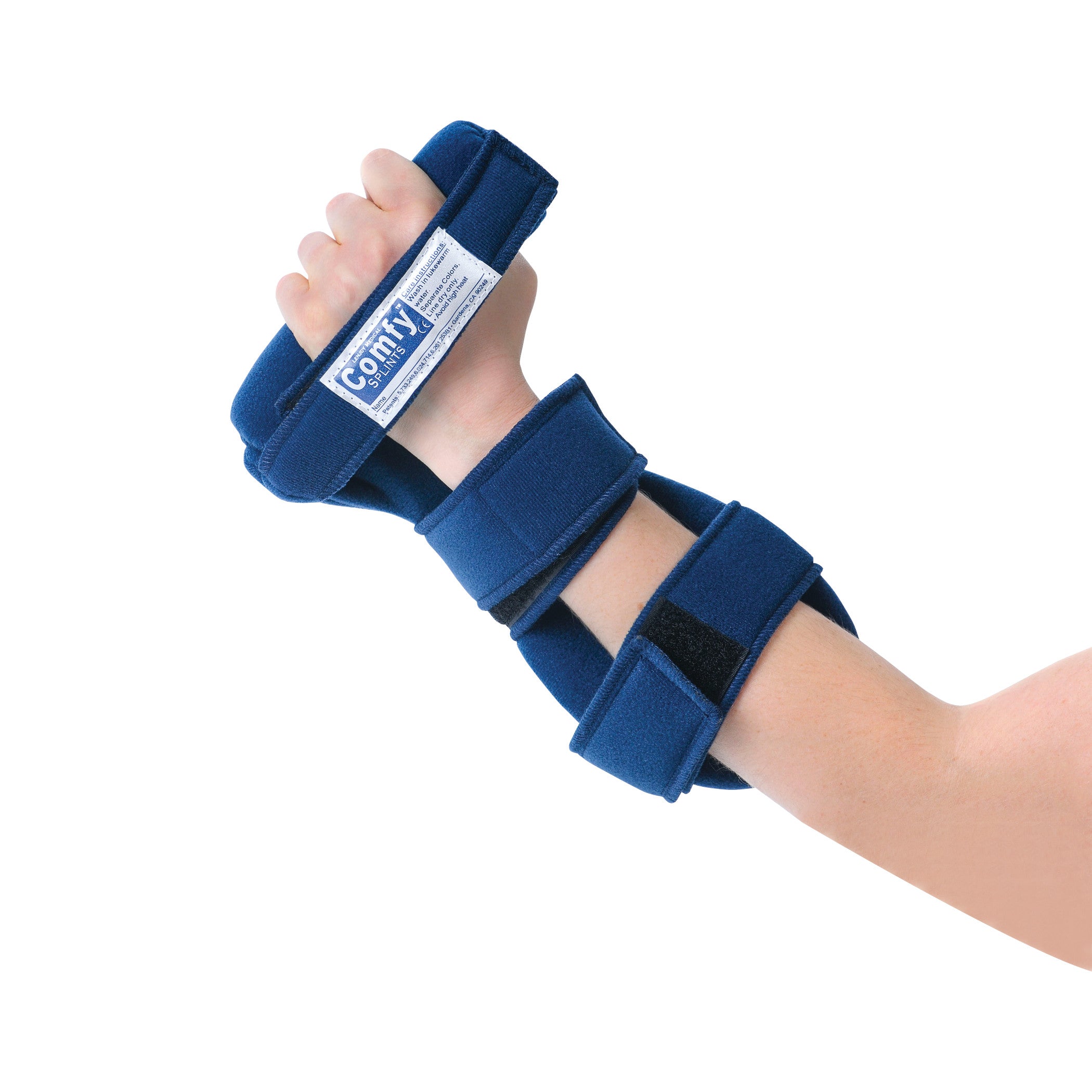 A forearm and hand are shown wearing the Comfy Splints Adult Grip Hand Orthosis. The orthosis is blue, with strap fastenings.
