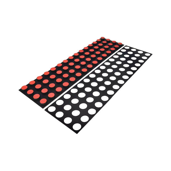 The Minnesota Manual Dexterity Test features two black boards, one with red circles and the other with white circles for manual skills assessment.