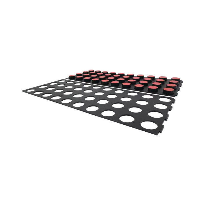 The image shows the Minnesota Manual Dexterity Test, featuring a black board with circular cutouts and red disks used for assessing fine motor skills.