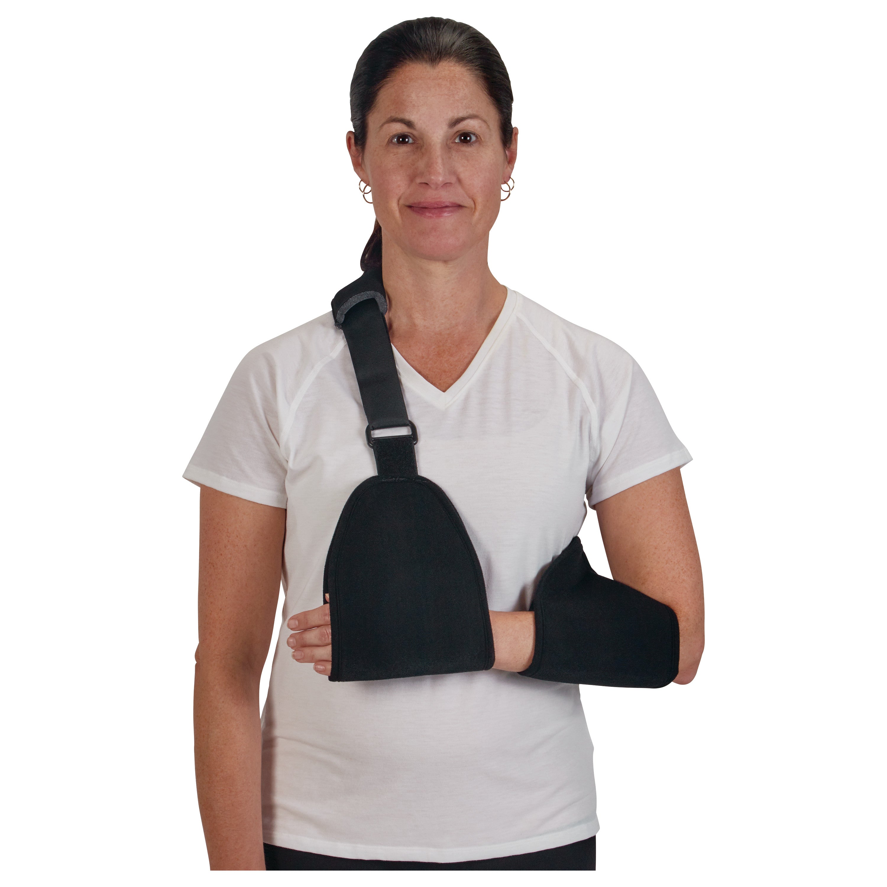 A woman wears a black CVA Sling, supporting her arm in a black pouch, with an adjustable shoulder strap, over a white shirt.