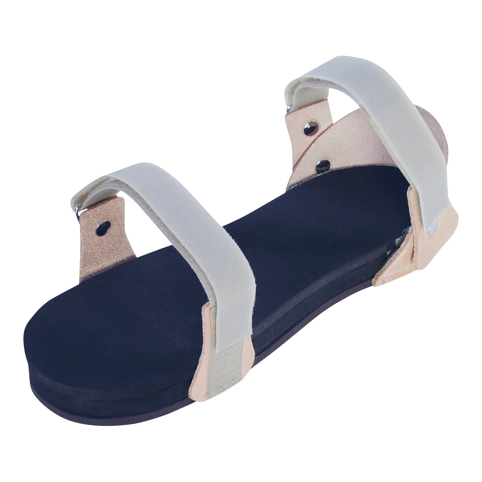 The Trial Elevation Sandal features a black footbed with adjustable beige straps and is designed to raise the heel for medical purposes.