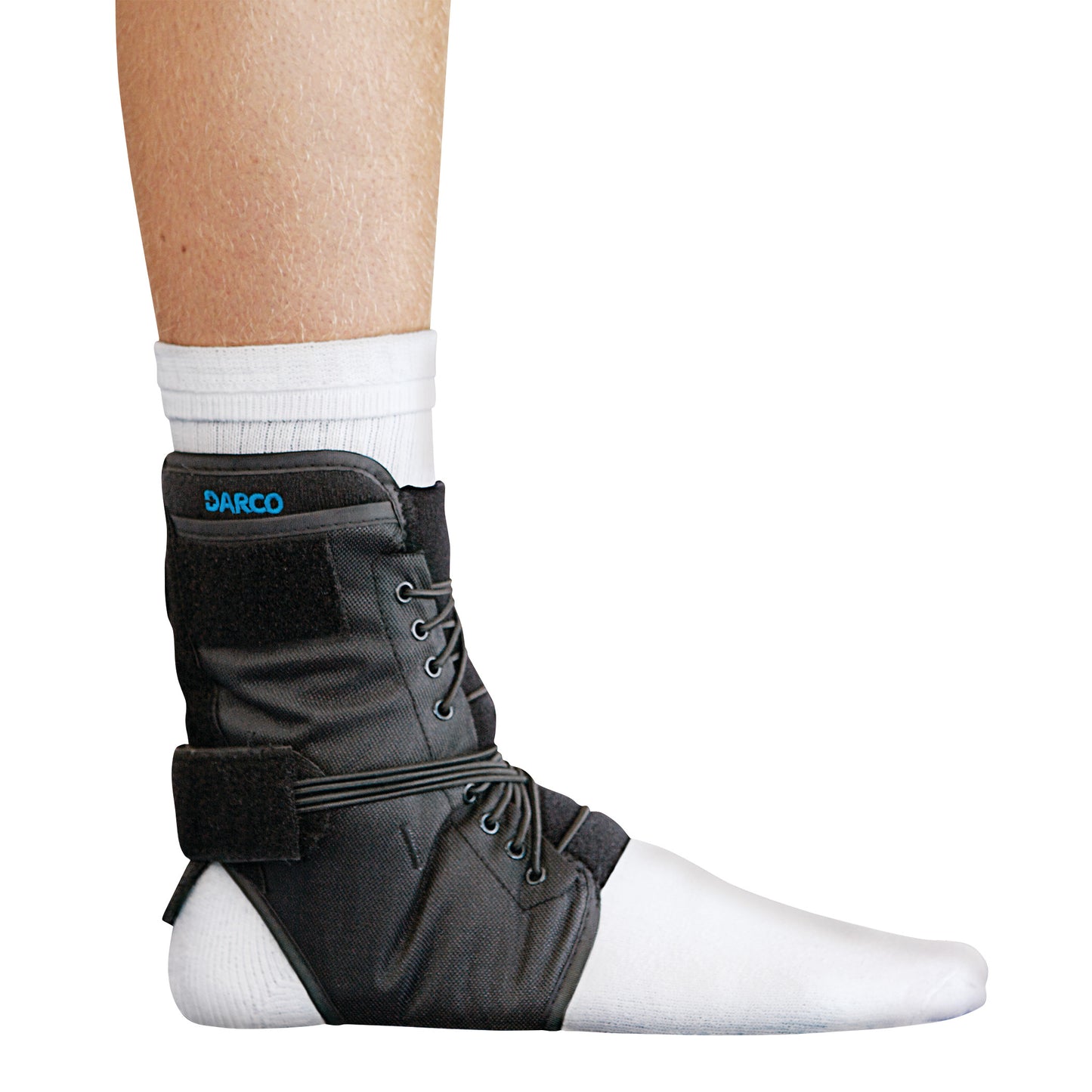 A leg wearing a white sock with a black DARCO Web Ankle Support, featuring laces and straps for stabilization.