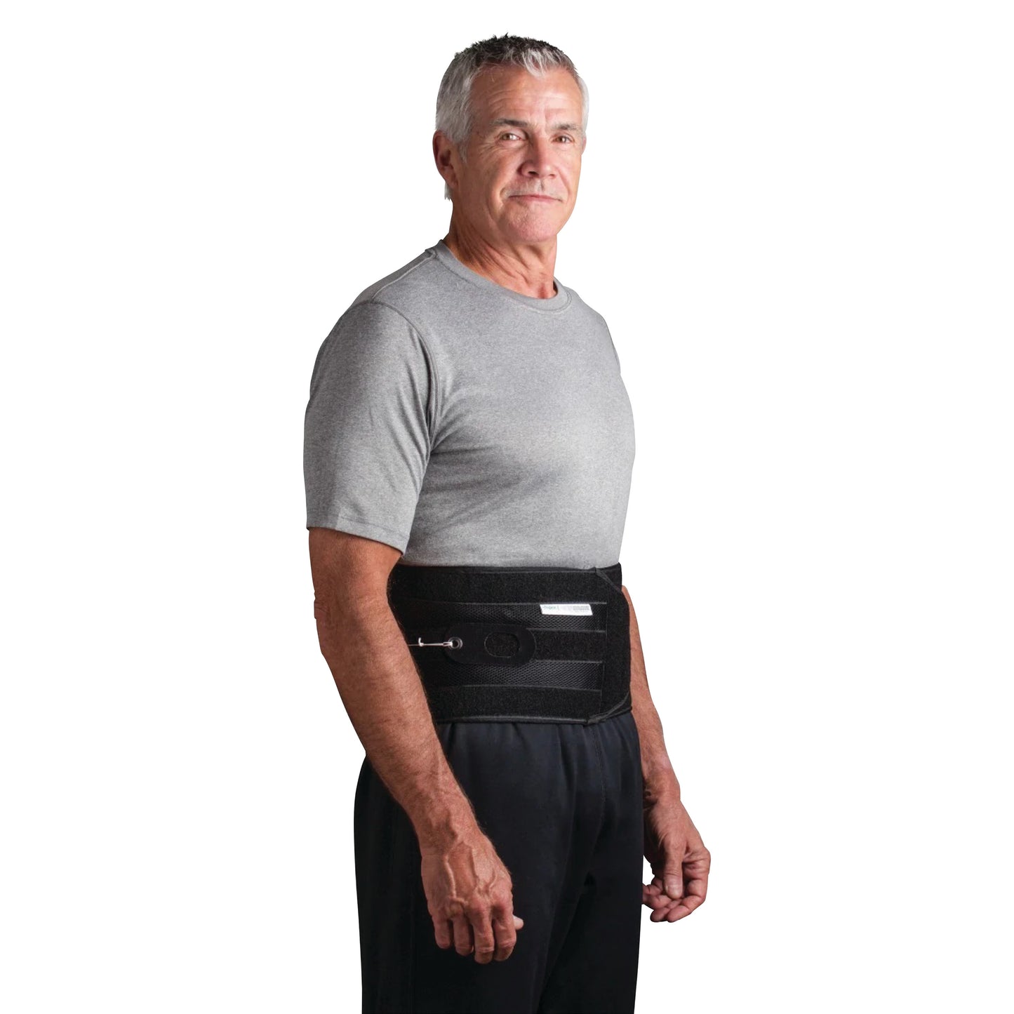 A person wearing a QuickDraw PRO Back Brace over their clothes, standing sideways, with a neutral expression.