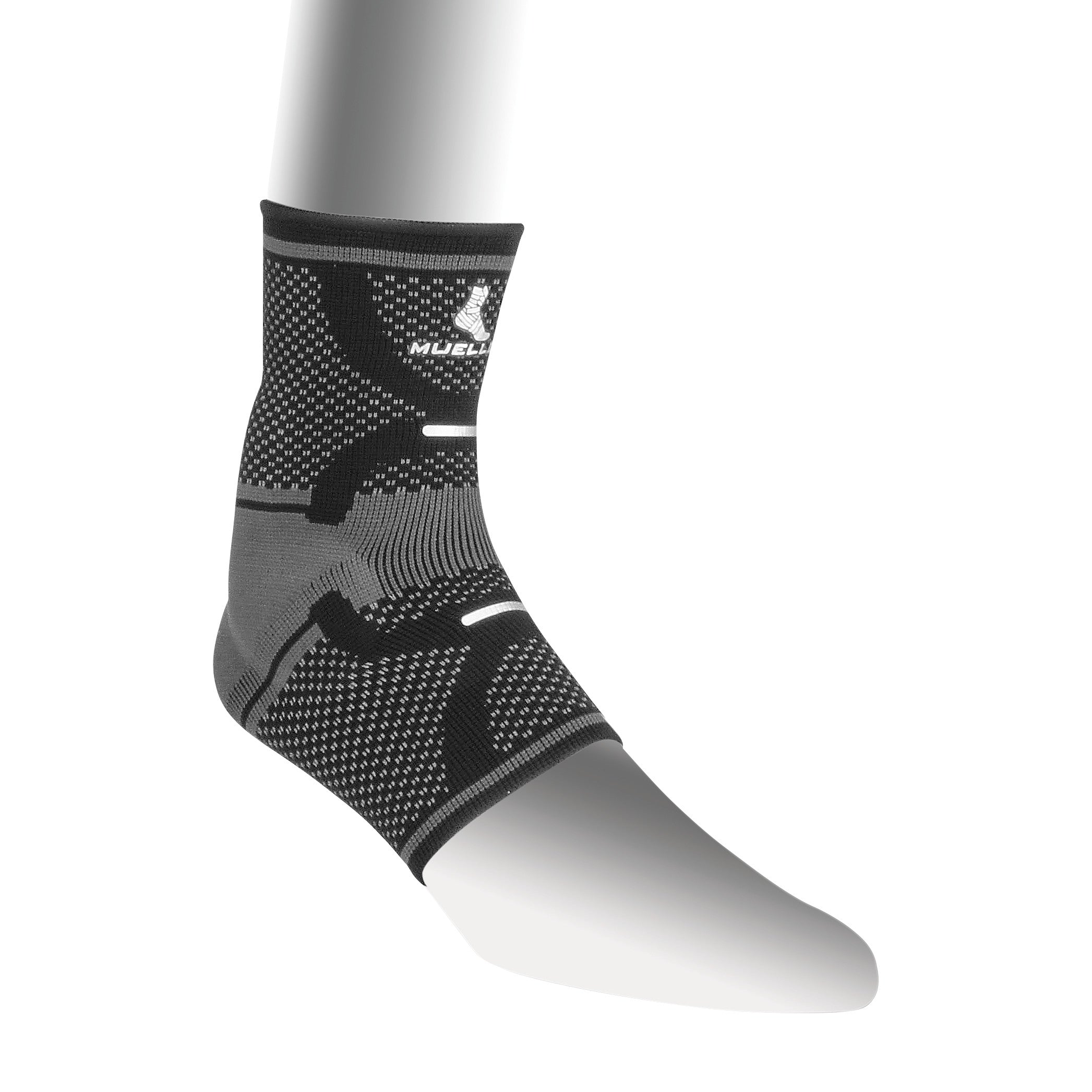 A gray and black Mueller Omniforce Ankle Support is displayed on a mannequin leg, featuring a textured and patterned design.