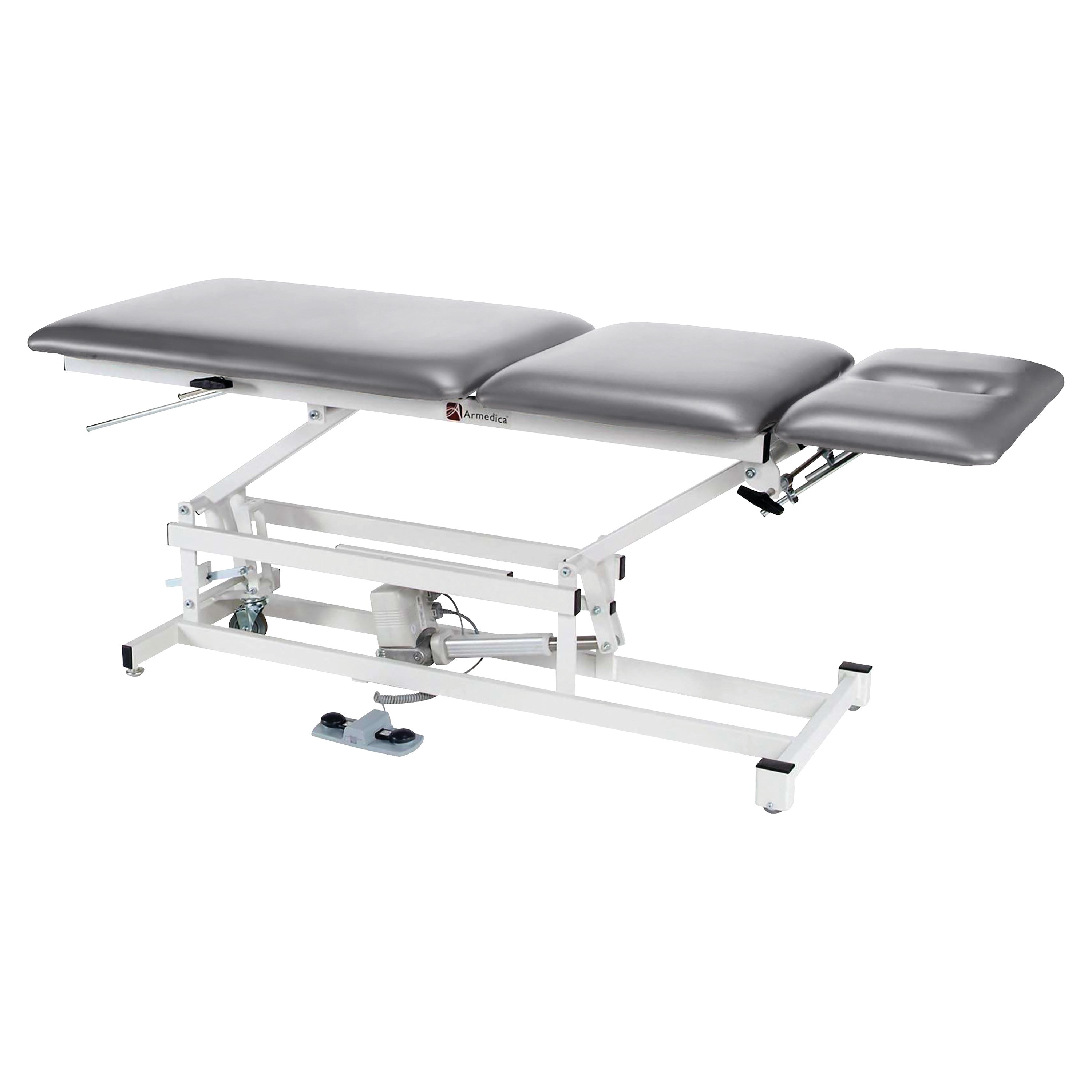 Armedica AM-350 Treatment Table with adjustable gray padded sections on a white metal frame, featuring a foot pedal.