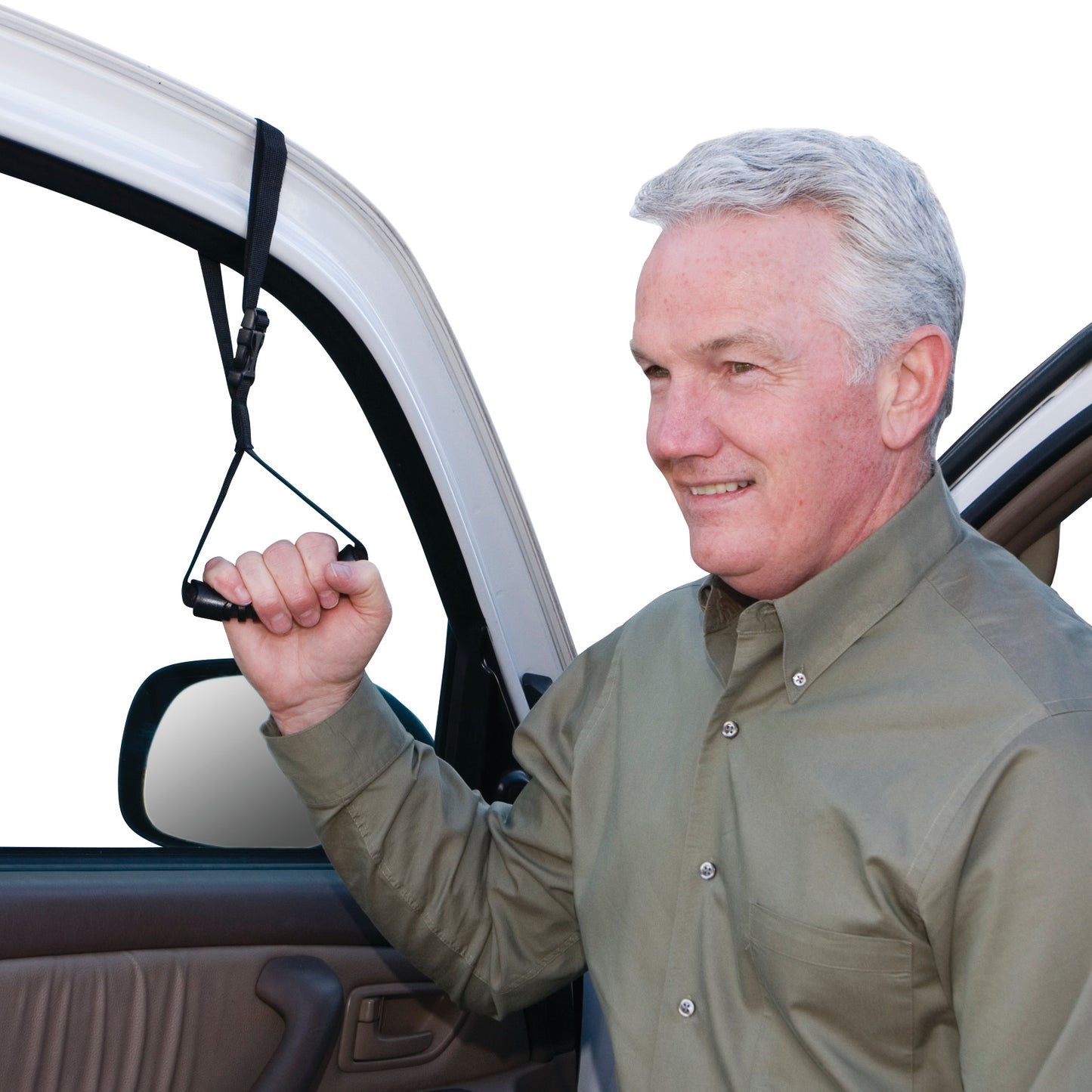 A man uses a Car Caddie, a black support handle strapped inside a car door, to assist with getting in or out of the car.