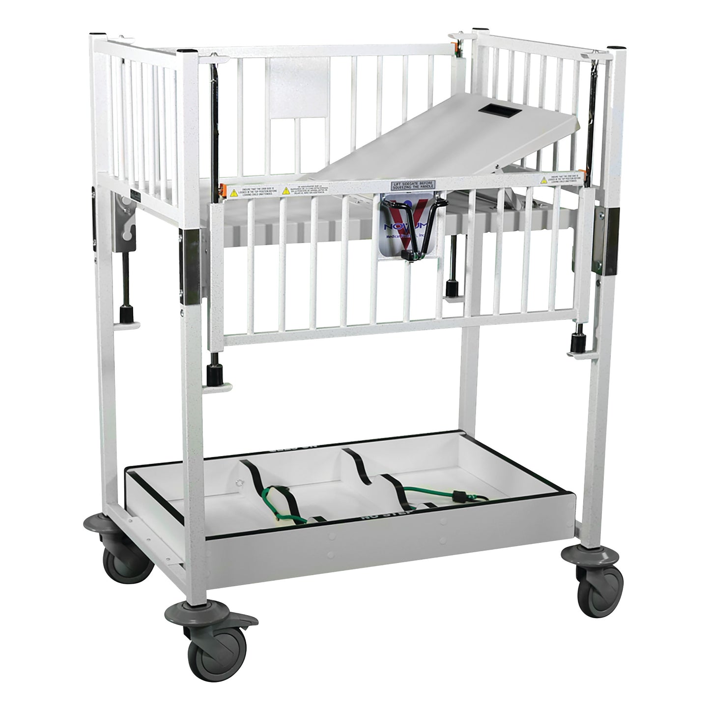 Novum Medical Neonatal Cribette with adjustable white metal frame, side rails, and lockable wheels, featuring an incline board.