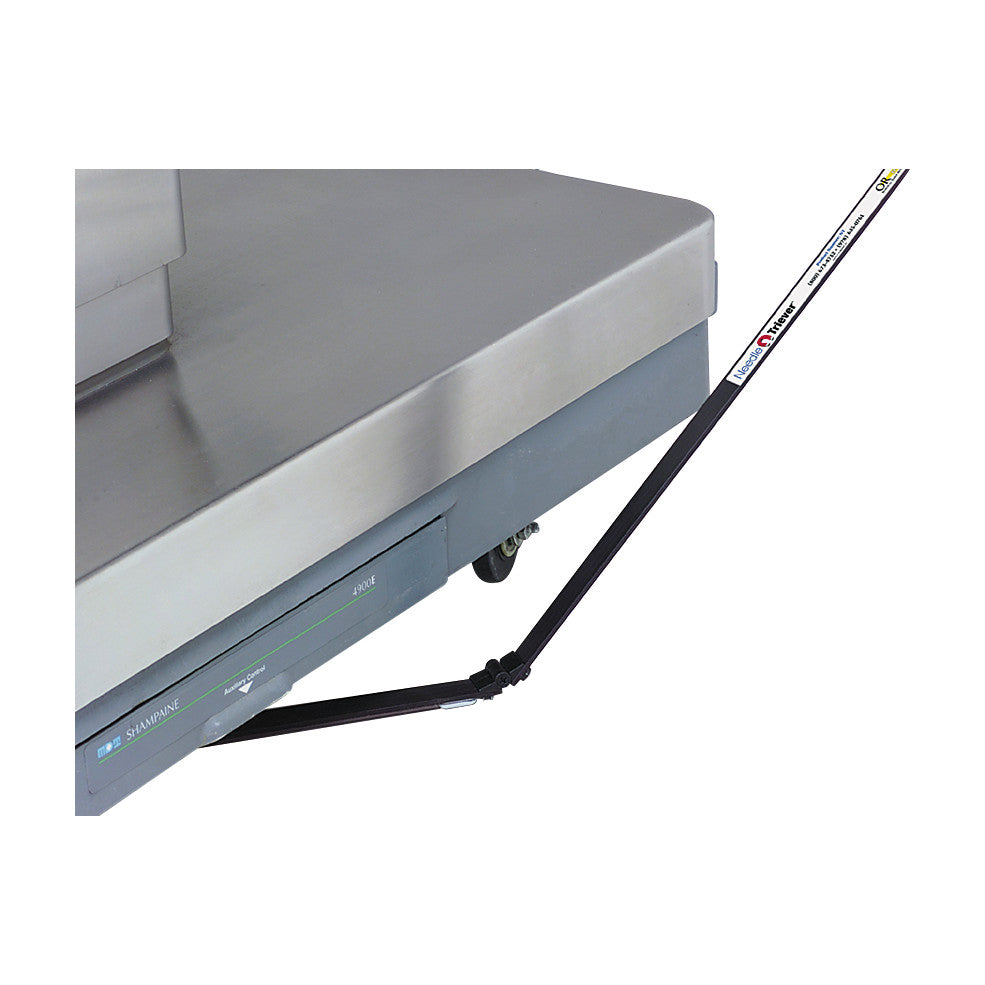 Allen Magnetic Needle Retriever attached to a metallic surface near wheels, designed for retrieving ferromagnetic items in medical settings.