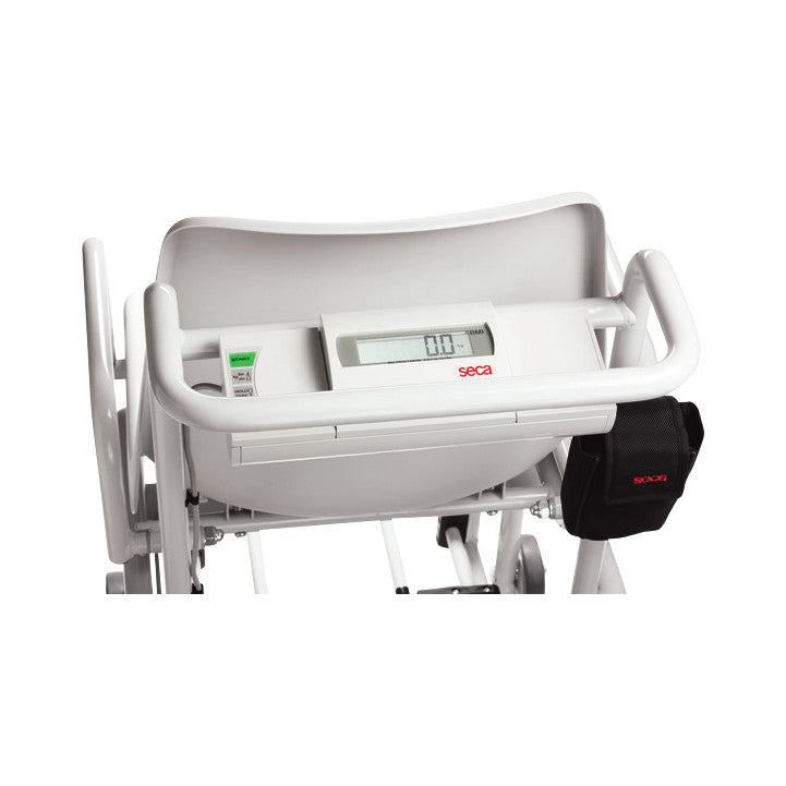 The seca 954 Chair Scale features a digital display and a seat, designed for weighing patients with limited mobility.