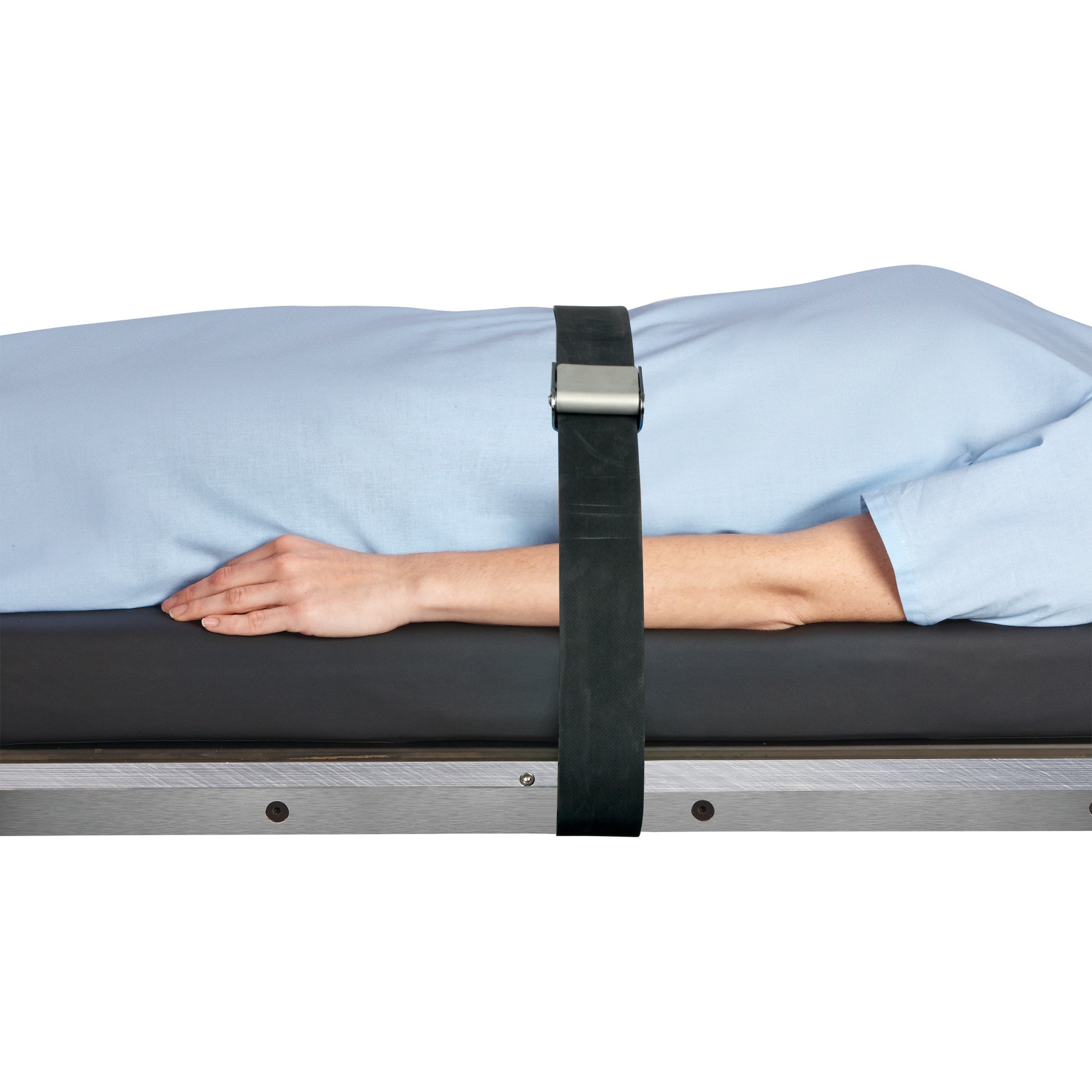 A person in a blue gown lies on a surface secured by an AliMed Economy Strap, featuring a black buckle, across their body.