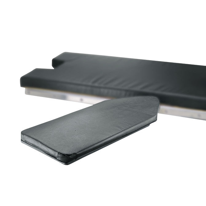 The Easy Extra-Wide Armboard, with black padding and a contoured shape, is shown alongside a larger black cushioned surface.