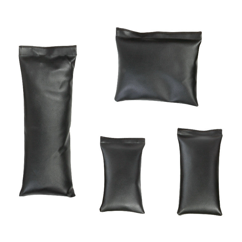 Four black sandbags of different sizes, part of the AliMed Pediatric Sandbag Set, displayed on a white background.