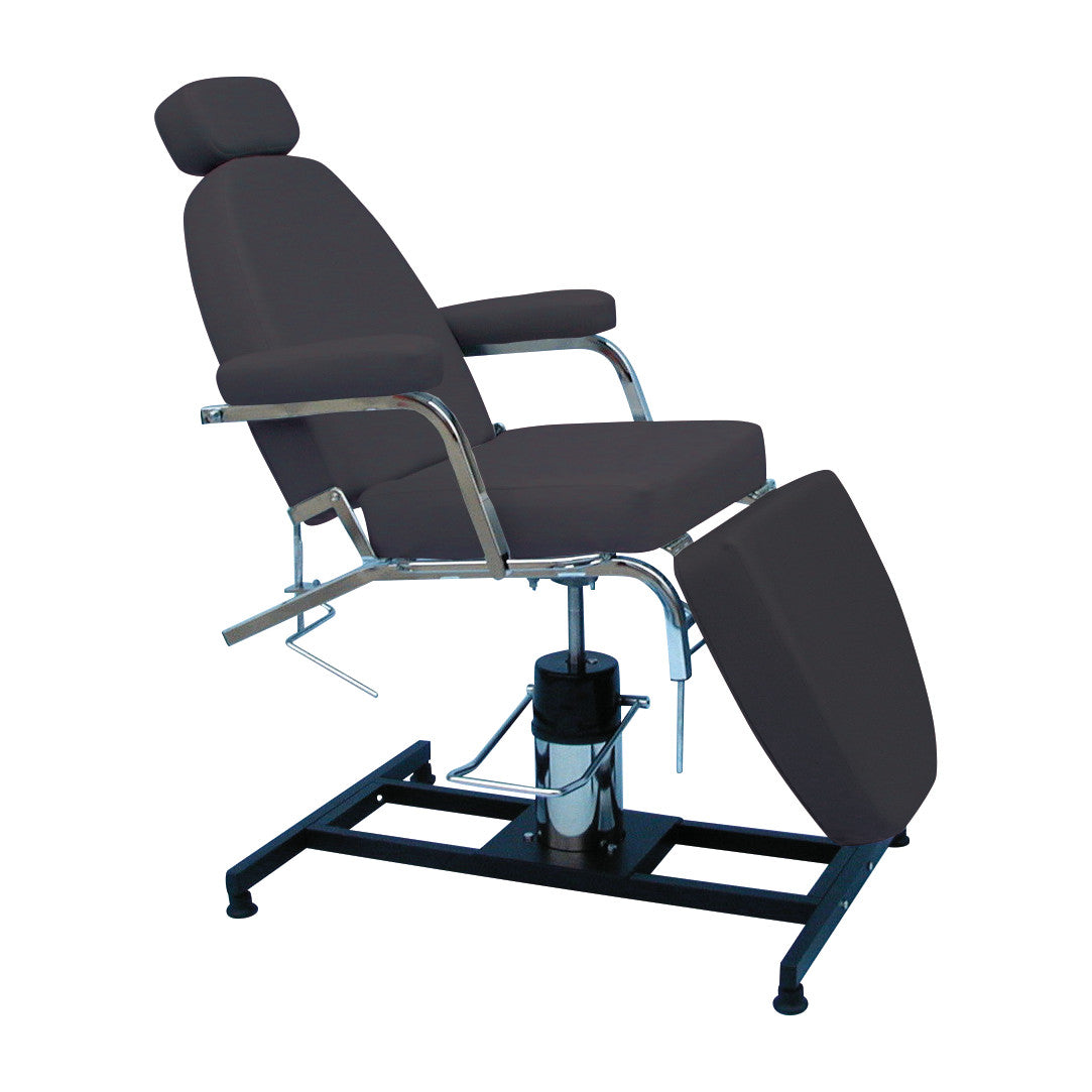 The Brandt Industries Procedure Chair is a black, adjustable chair with a reclining back, footrest, and chrome armrests on a sturdy base.