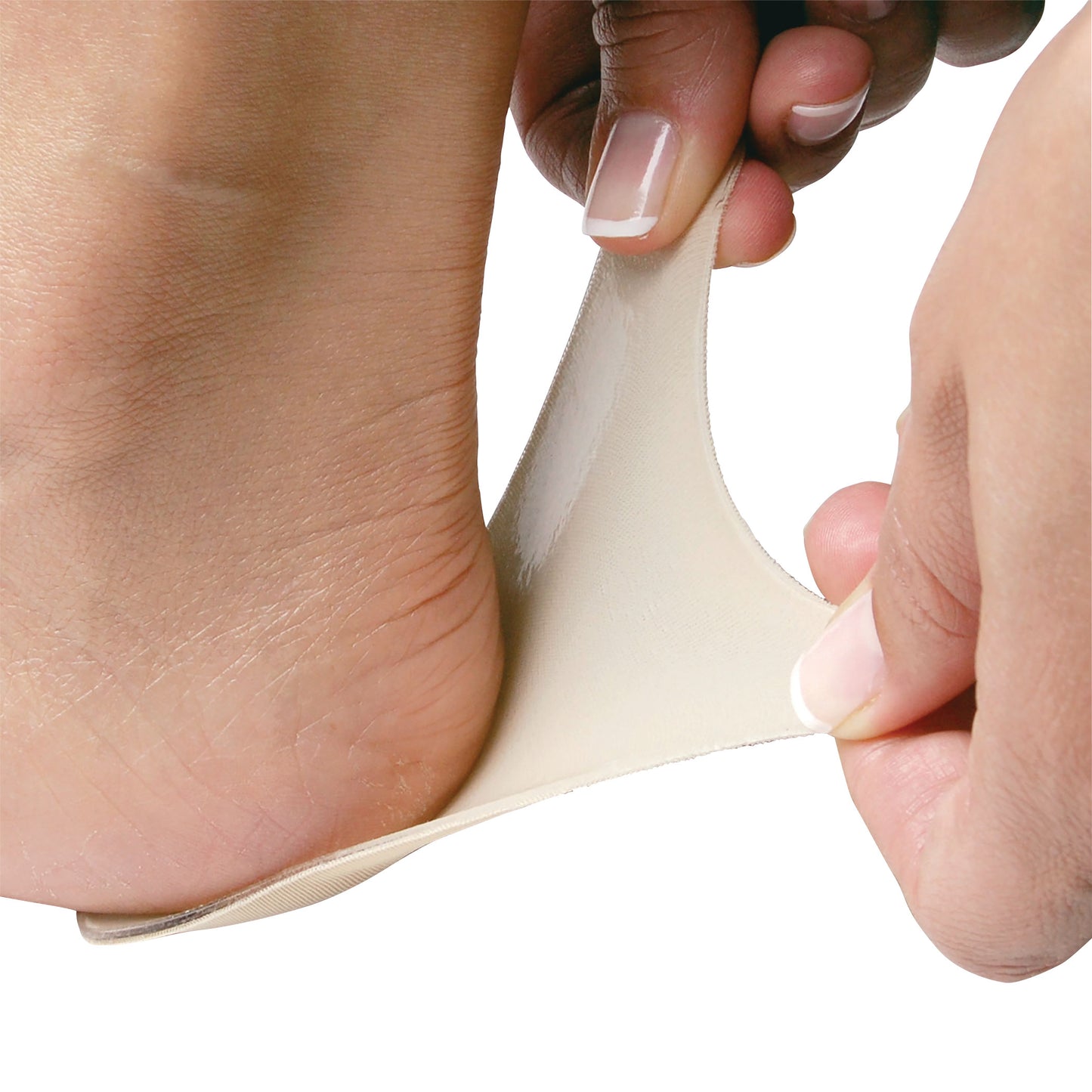 Close-up of a foot with PediFix Visco-GEL Self-Adhesive Gel Sheeting being applied to the heel by a person's hands.