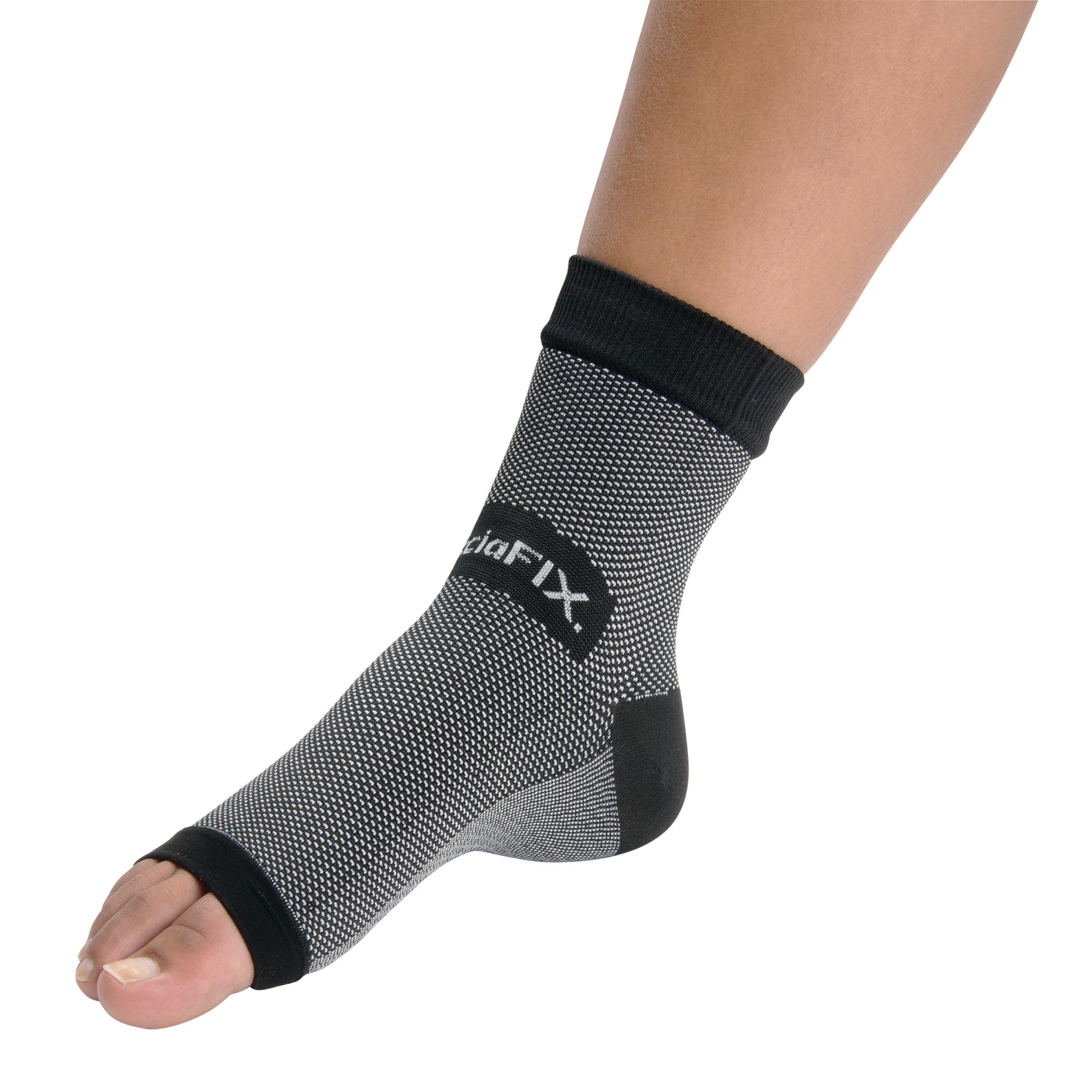 A foot wearing a PediFix FasciaFIX Plantar Fasciitis Relief Sleeve, a gray compression sleeve with open toes and black trim.