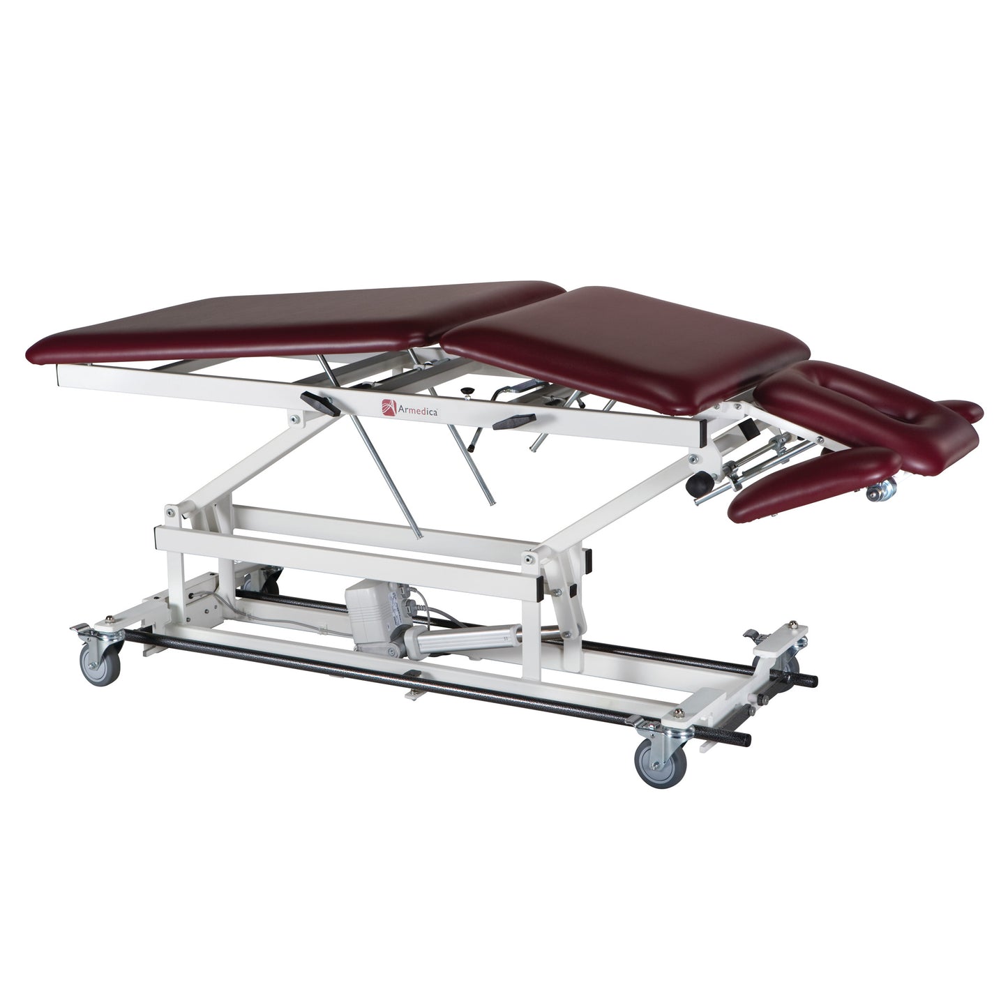 Armedica AM-BA500 Treatment Table with burgundy cushions and adjustable sections is equipped with wheels for mobility.