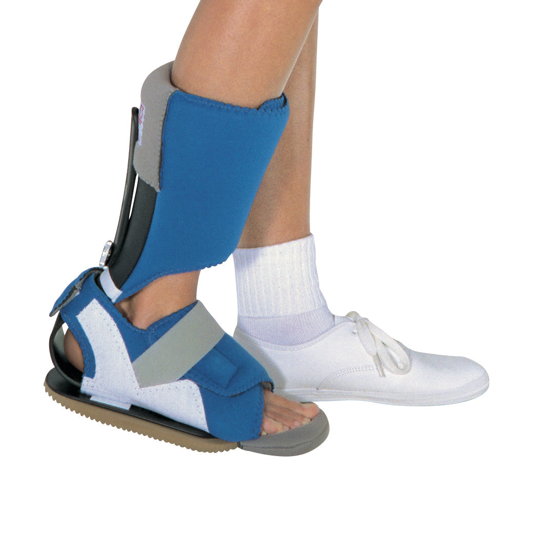 A person wearing the RCAI MPO 2000 Active Orthosis on one foot, with the other foot in a white shoe, showing a blue and gray brace.