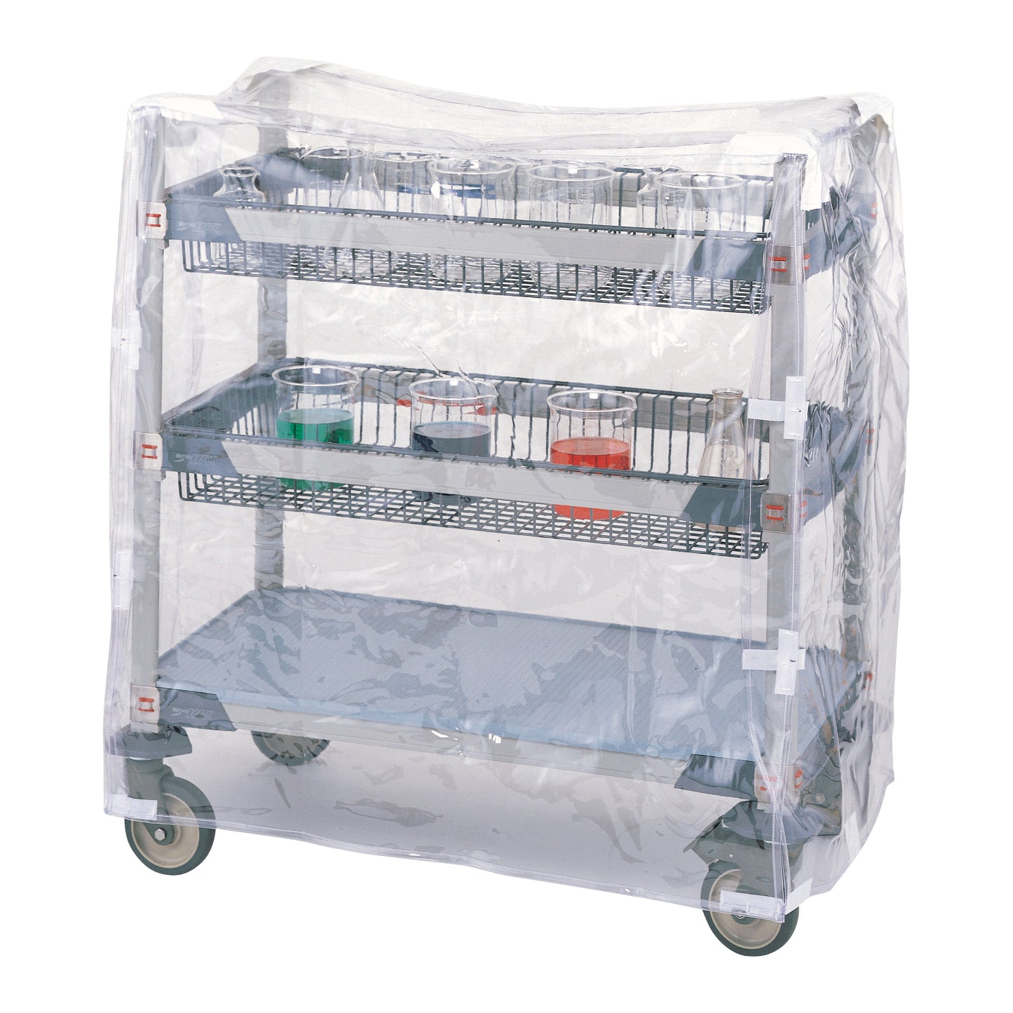 A metal cart with wire shelves holds beakers and is covered by a Metro Clear Vinyl Cart Cover, secured with hook-and-loop fasteners.