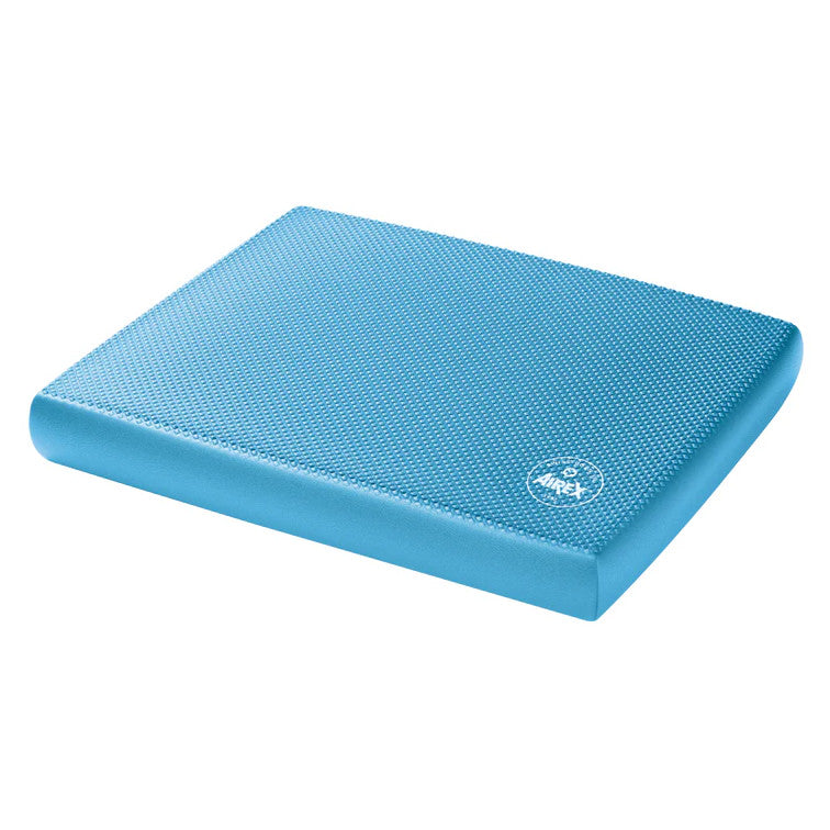 The AIREX Elite Balance Pad is a blue, textured, rectangular foam pad with rounded edges and a logo imprint.
