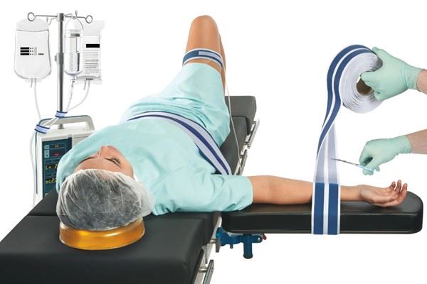 patient lying on operating table with head donut positioner and patient safety straps